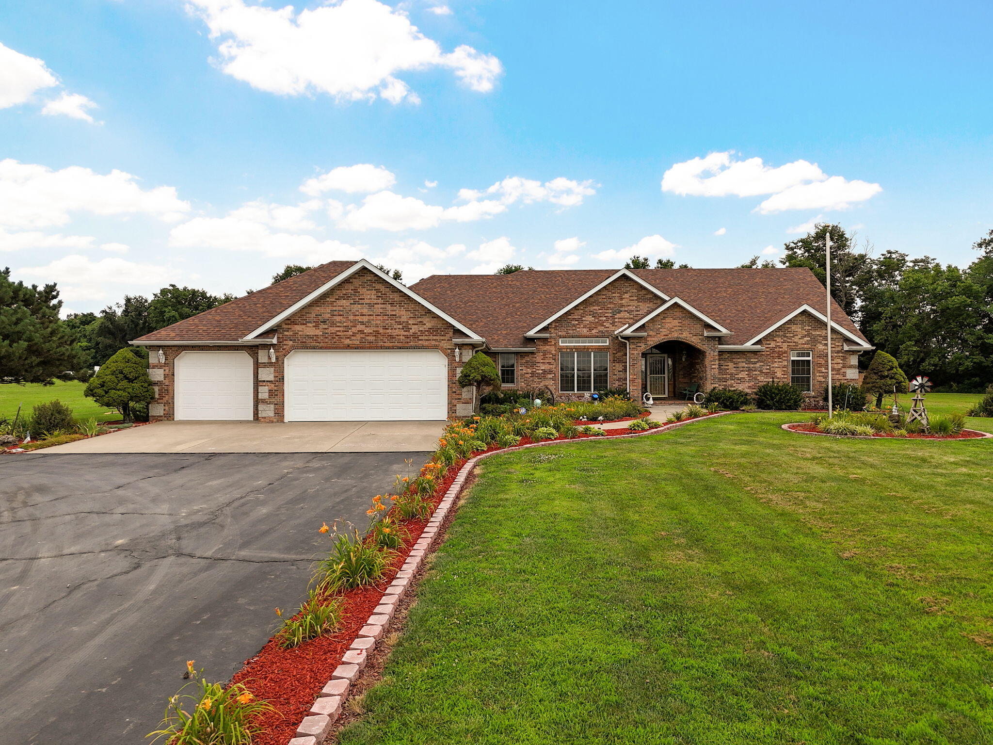 Impressive single-owner home on 5 pristine acres. 3,218sqft on a SINGLE level!  Meticulously maintained with newer roof and HVAC. Enjoy privacy with white picket fence and privacy fenced backyard with gazebo. Features large shop with concrete floors, water, and electricity. Spacious heated and cooled sunroom and bonus room that could be a 4th non-conforming bedroom or office.