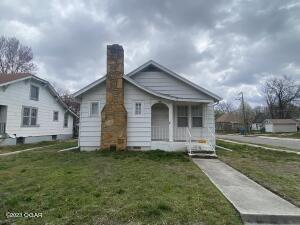 Great investment property or home owner can live in house and rent out garage apartment! Two homes on one lot. Selling ''as-is'' (does need work)
