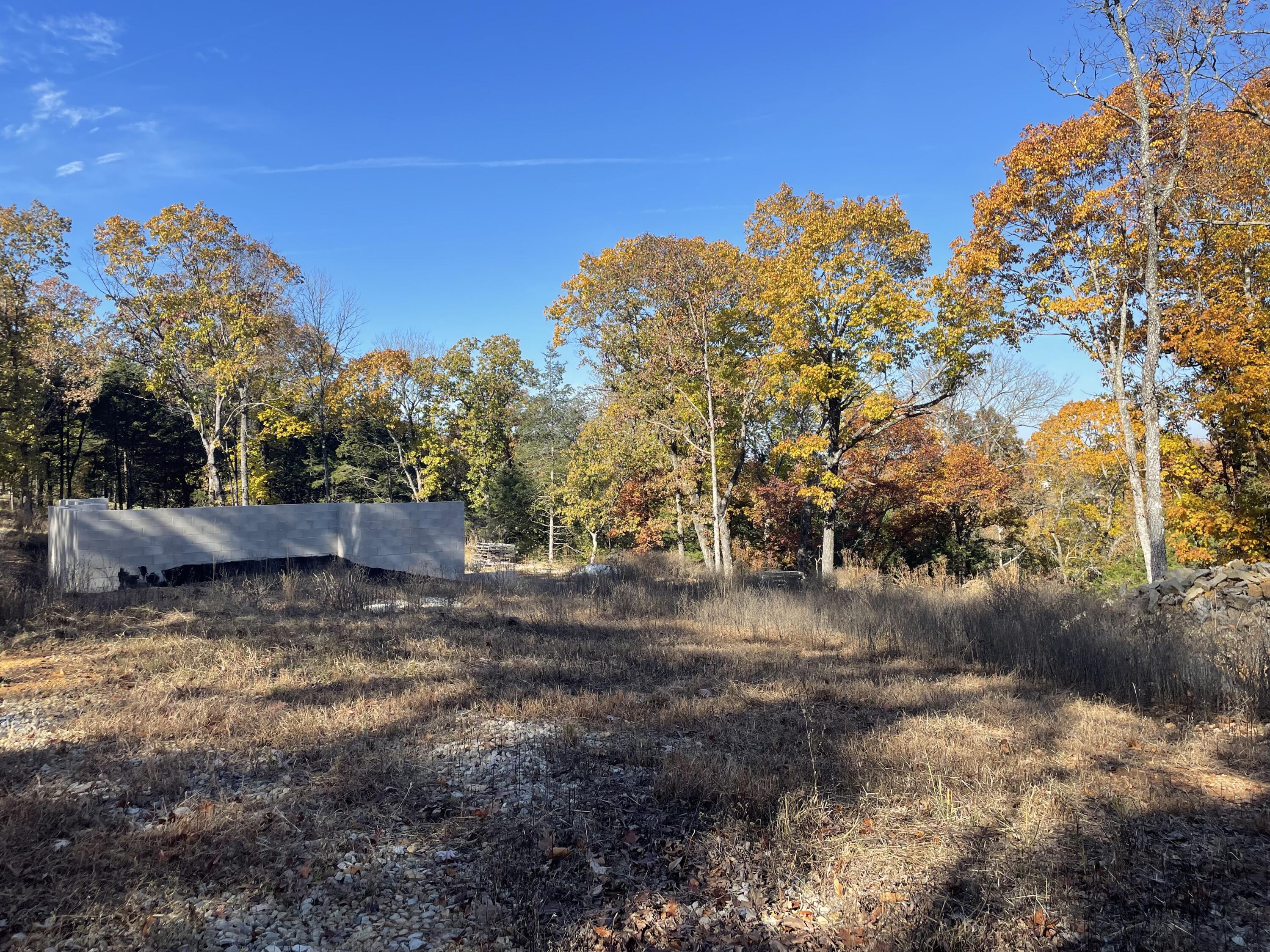 Nestled in a quiet suburb, this beautiful subdivision land lot boasts an abundance of mature trees, providing a stunning backdrop for your dream home. The lot's partially finished basement foundation adds even more potential, allowing you to customize your living space to your exact specifications. Whether you envision a cozy family room, a home theater, or a private gym, the possibilities are endless. A significant amount of clearing has been completed and gravel brought in with the potential for a garage or shop to be built. With plenty of space for a spacious yard, you can create your own private oasis, perfect for entertaining friends and family or simply enjoying a quiet evening outdoors. Don't miss out on this rare opportunity to create your dream home in a peaceful and picturesque setting.1,800 sq ft home plans available if desired. Meter purchased, water and electric at the road for easy hookup. Enjoy a creek at the property's edge and horse-friendly approval. Your dream home starts here.