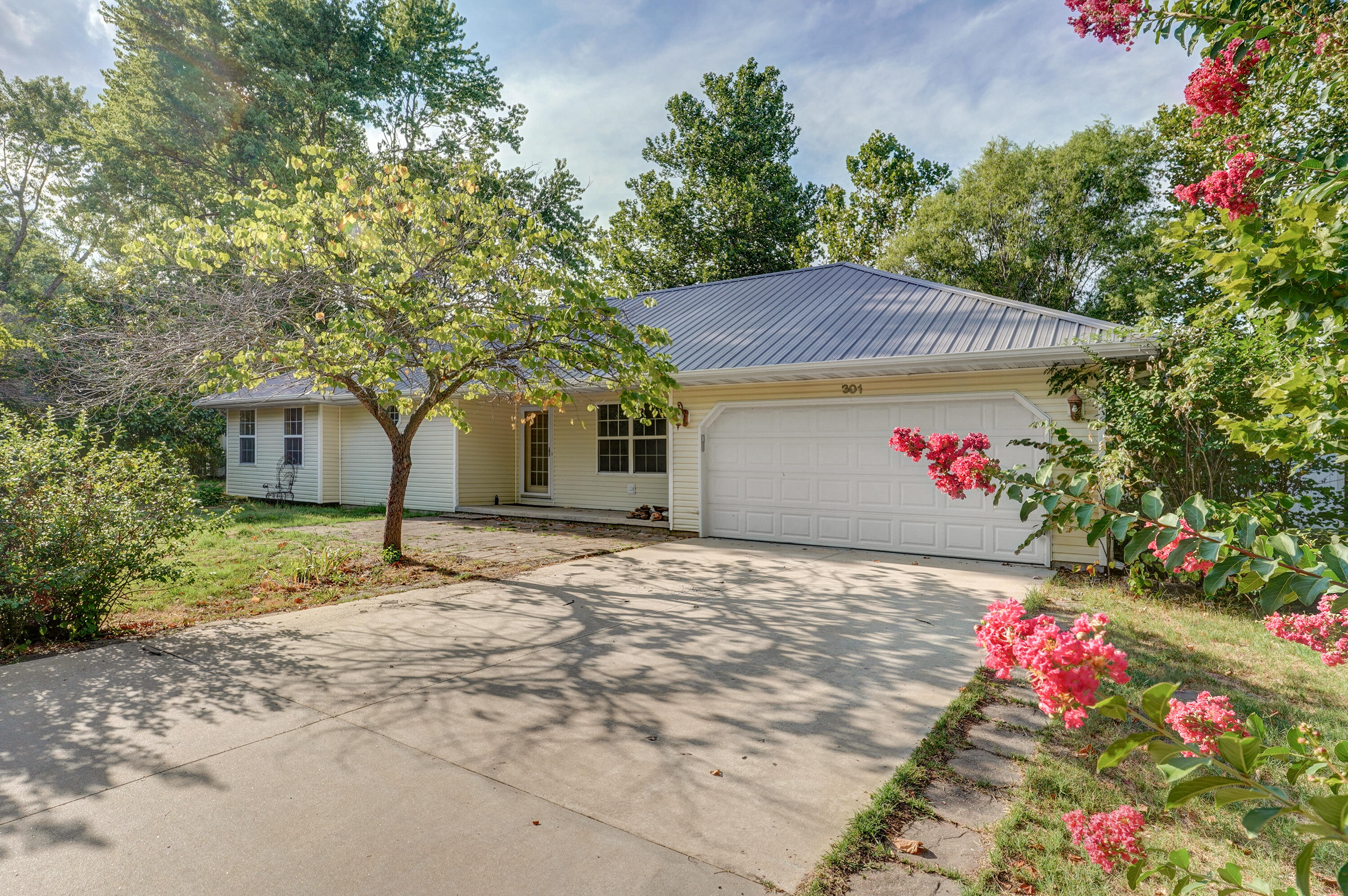Don't miss out on this one owner home in Marionville! This 3 bed/2 bath house is very roomy and offers a great amount of storage space. Through the front door, you will be welcomed with a large vaulted ceiling in the living room. The kitchen features butcher block countertops, a copper farmhouse sink, and large cabinetry for all your kitchen storage needs! The master bedroom provides a good amount of room and lots of natural light. It also features an ensuite master bathroom with a walk-in shower, jetted tub, and a walk-in closet. In the garage, there's a work area with a door that leads to the fenced in backyard with TWO metal 12x24 storage sheds (one has electricity and A/C). Sellers are willing to offer $500 in sellers concessions for the carpet in the bedroom!