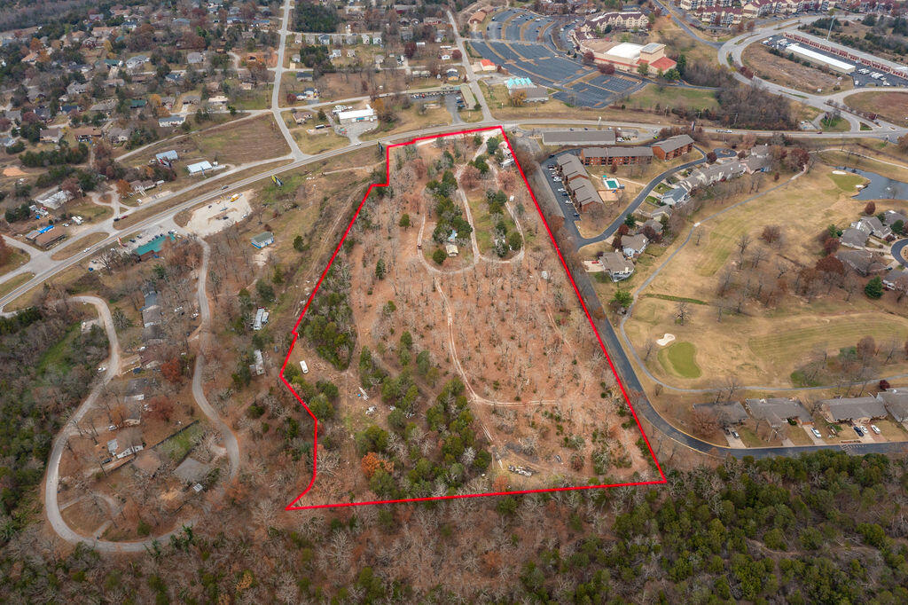 13 Acres with 335 ft of Hwy 165 Frontage! Great location next to Pointe Royale.  City water & sewer!  Property was previously a campground. Property has many different commercial opportunities, RV park, Resort, Restaurant and so much more!