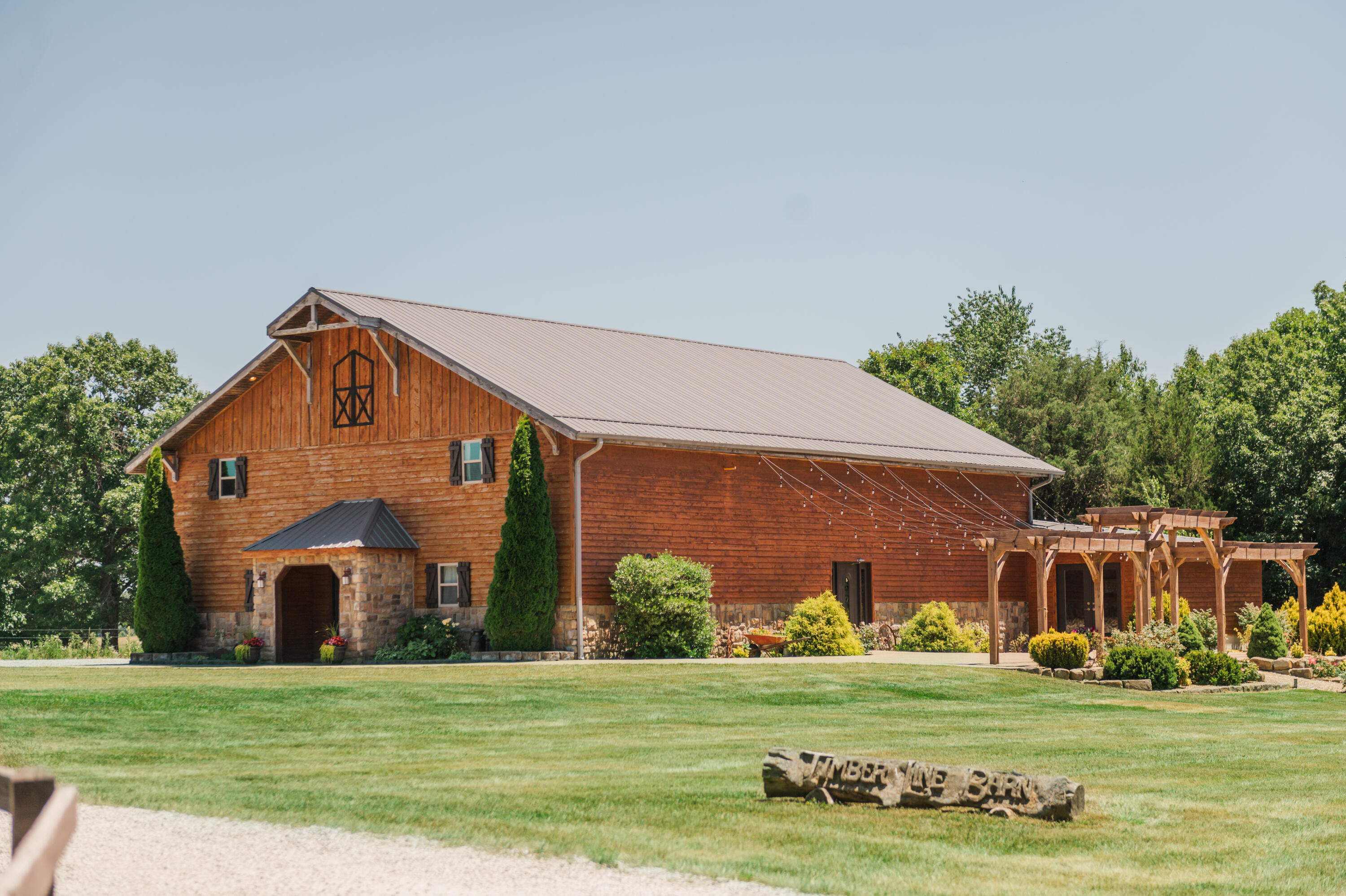 Welcome to Timber Line Barn!  Since 2013 this very well known venue, located a short drive north of Springfield on HWY 65, has been home to hundreds of loving couples walking down the aisle and saying I DO.  Now it is ready for you to be a part of the next series of beautiful moments.  5 acres of lush acreage complete with outdoor ceremony, a 200 person capacity indoor ceremony/reception area, ample parking, bridal suite, groom suite and the list goes on.  This is a thriving turn key business with an average of 60-70+ weddings per year and includes an extensive inventory list of chairs, tables, decor etc.  On top of hosting weddings it can host corporate events, school dances, fall festivals, retreats and meetings of all sizes.  Sale includes everything that goes along with the business including timberlinebarnweddings.com, all social media platforms and client lists.  Schedule your showing today and become the owner of a very successful and profitable business and a stunning piece of property!