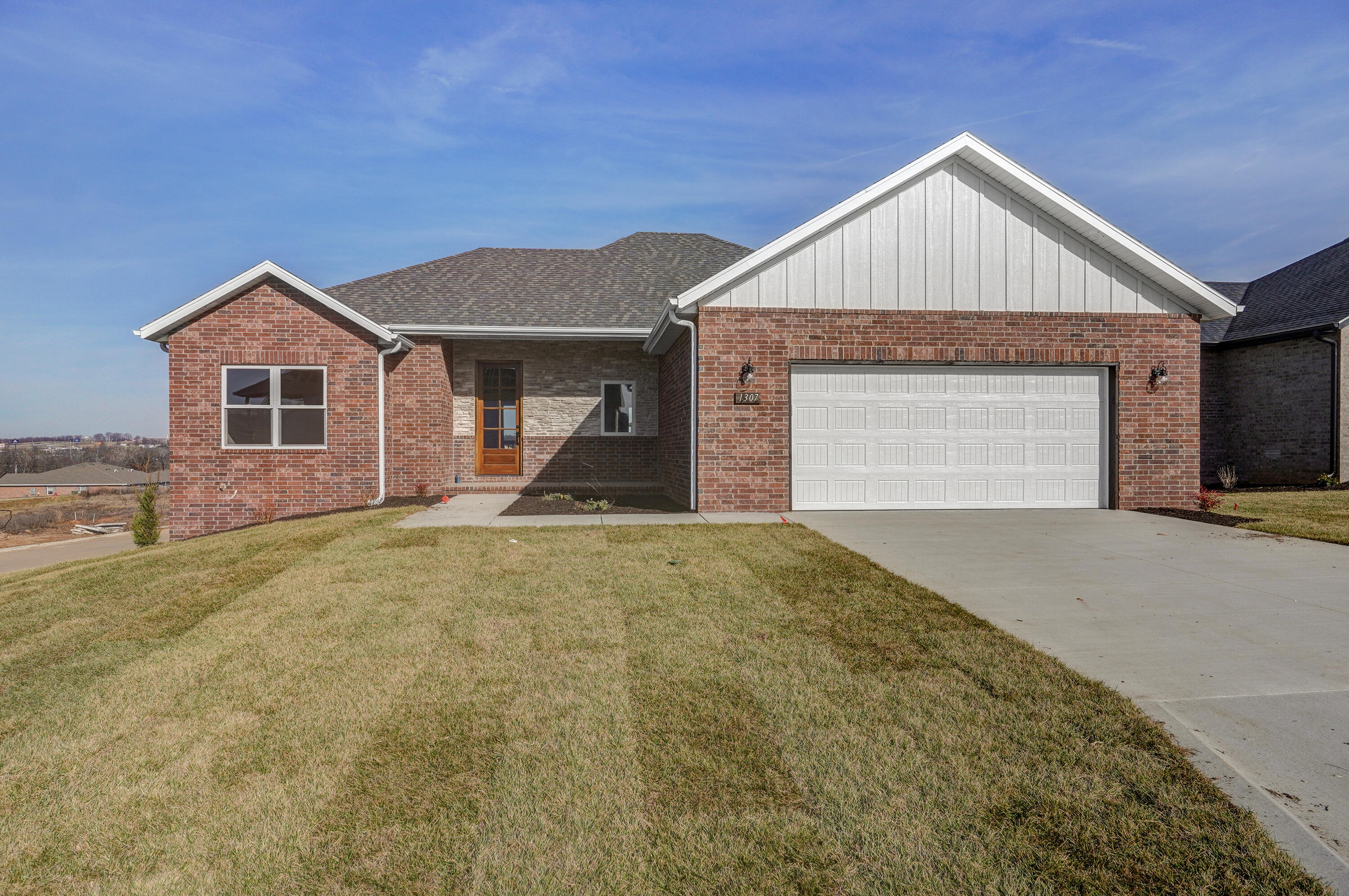 OPEN HOUSE Saturday 2/25 & Sunday, 2/26, 1:00-3:00!Brand new floor plan brought to you by Oller Building Company.  Developed by the same developer who brought Ozark Olde World Estates.  This home offers 3 beds, 2 baths, oversized 2 car garage (22X24), covered front porch as well as a covered back porch.  The back porch faces north with views to the west!  You will get to enjoy the beautiful sunsets here in the Ozark Mountains.  Inside the home you will find a shotgun floor plan with white cabinets paired with black granite counters.  This home has so much to love.  Oller Building homes come standard with Andersen windows, home audio system, custom full wood cabinets with all soft close doors/drawers, gas range, granite countertops, tile master walk in shower, oversized trim, and fully irrigated yards.