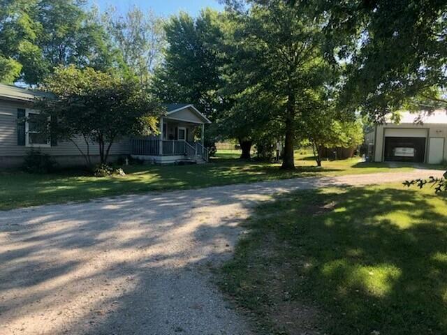Loving that farm life!!  766ac m/l in southwest MO fit for a farmer.  Diversified farm with near equal acreage divided between row crop and pasture.  405 ac in tillage, 272.5 ac in pastureland and 82 ac where the deer and turkey are plentiful!!  Property has 2 separate residences.  The original 3 BR, 2 BA farm house built in 1964 with a fire place and full unfinished basement.  The home has many new updates including a new roof and septic put in less than a year ago. Also on the property, a3BR, 2BA modular set up in 1999.  The home is super clean, also with many updates. This farm was enrolled in USDA Conservation Stewardship Program until 2020, practicing no-tillage, split application of fertilizer on pastureland, buffer strips, wildlife areas and bee pollinator area.  Most crop areas have terraces and waterways designed to reduce erosion.  This property boasts 6 Updated Shops and sheds, two having a cement floor and a 9000 Bushel Grain Bins Storage with stairway drying system.  Cattle working area with weaning lots and bull loafing lots complete with new pipe fencing installed in 2021.  One of the locations also has a solid barn built in 1915, with Mangers and a working chute. All fences are newer and cattle tight.  4 waterers, ponds and blocked in springs provide ample watering for your livestock.