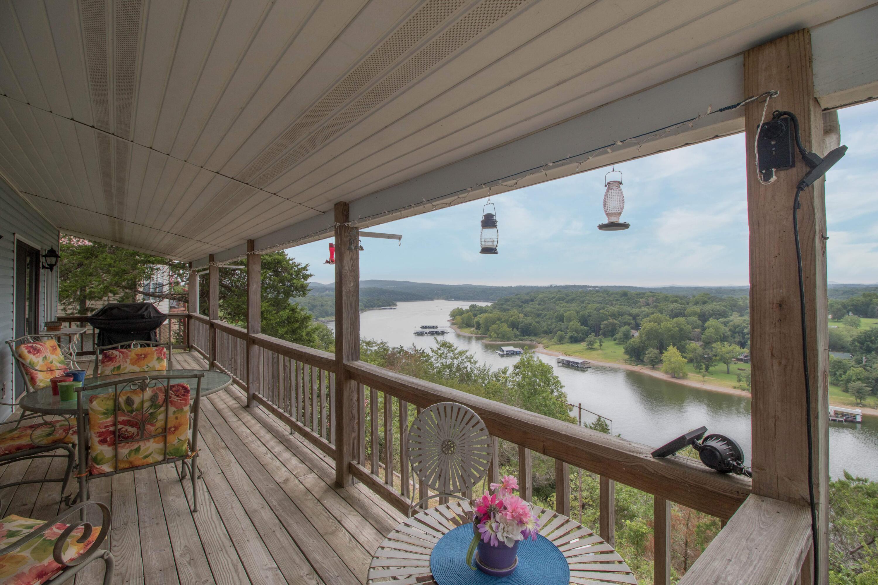 Lake Front Home on Beautiful Table Rock Lake! If you are an avid fisherman or just love to look at the lake,you will enjoy this home with an amazing Lakeview. Sit on the coverd back porch and enjoy your morning coffee or  evening cocktail overlooking the lake! This one owner home has been well kept and is ready for you to move right in! On the main level you will find a large living room, dining room and kitchen/dining area, one bedroom,  one full bath and an oversized 2 car garage.  On the lower level is a spacious family room, one bedroom and a full bath, laundry plus a utility room and a large workshop for all your hobbies/projects! All this plus a double lot across the street! Public access is just 2 miles down the road! Additionally, Eagle Rock Marina is just 8 miles away. Roaring River State Park and Eureka Springs are both within an 18-mile radius. Silver Dollar City is a short drive away, and Dogwood Canyon is only 16 miles away. This unbeatable location offers a blend of natural beauty and convenient proximity to attractions, making it an exceptional opportunity for those seeking a lake retreat. 2 Lots across the street are included in the price. BRAND NEW ROOF! 2023  Schedule your private viewing today!