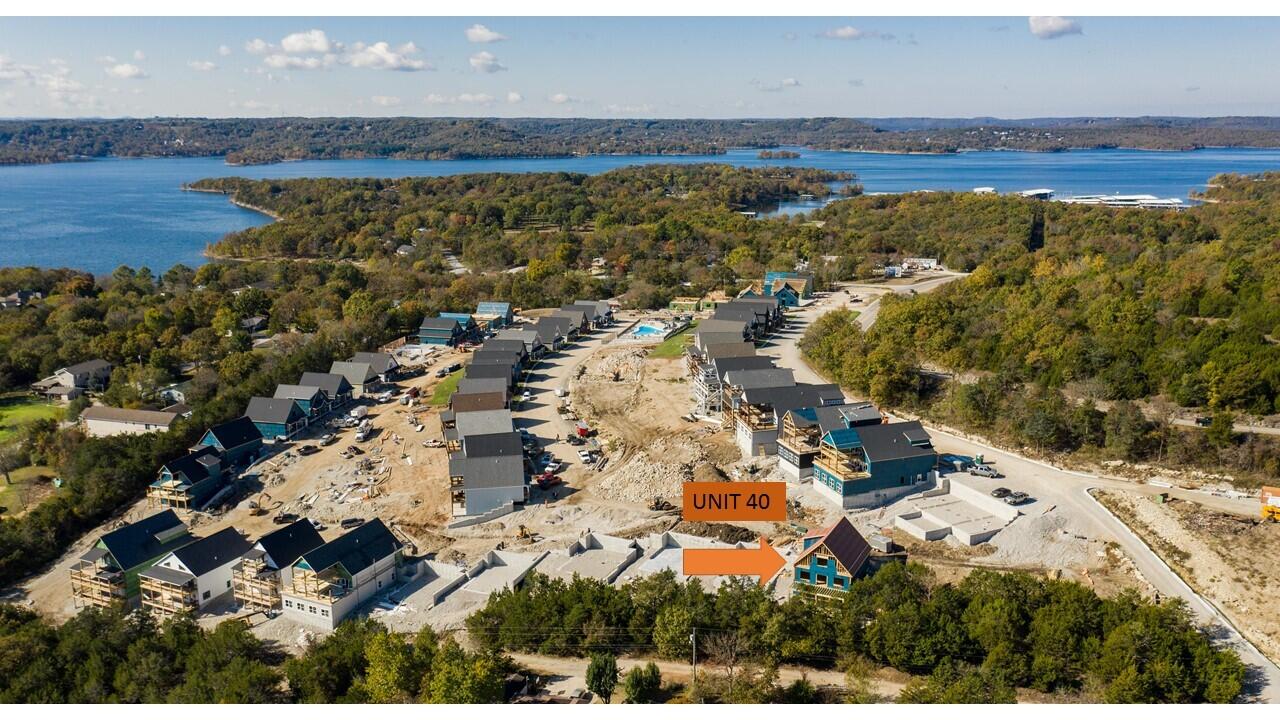 Blow-out view of Table Rock Lake! New construction located in the new Branson Cove Complex. This complex has been approved by Taney County to be used as Nightly Vaction Rentals, so whether you're looking for a great investment, or your own private getaway, this is the perfect place for you. The unit is being sold unfurnished & undecorated so you can add your own personal touches. The property will have a 1 yr. builder warranty from the date of completion. The complex offers a lakefront park and you can walk right to the waters edge. It has an outdoor pool with a waterpark slide and it will also have an inside pool. State Park Marina is located right next door where you can check for boat slip rental. It's also conveniently located to downtown Branson for plenty of entertainment, shopping and dining; and when you're ready for some thrills, head out to Silver Dollar City which is about 15 minutes away. Property taxes are only on the lot as they haven't been assessed on the build yet.