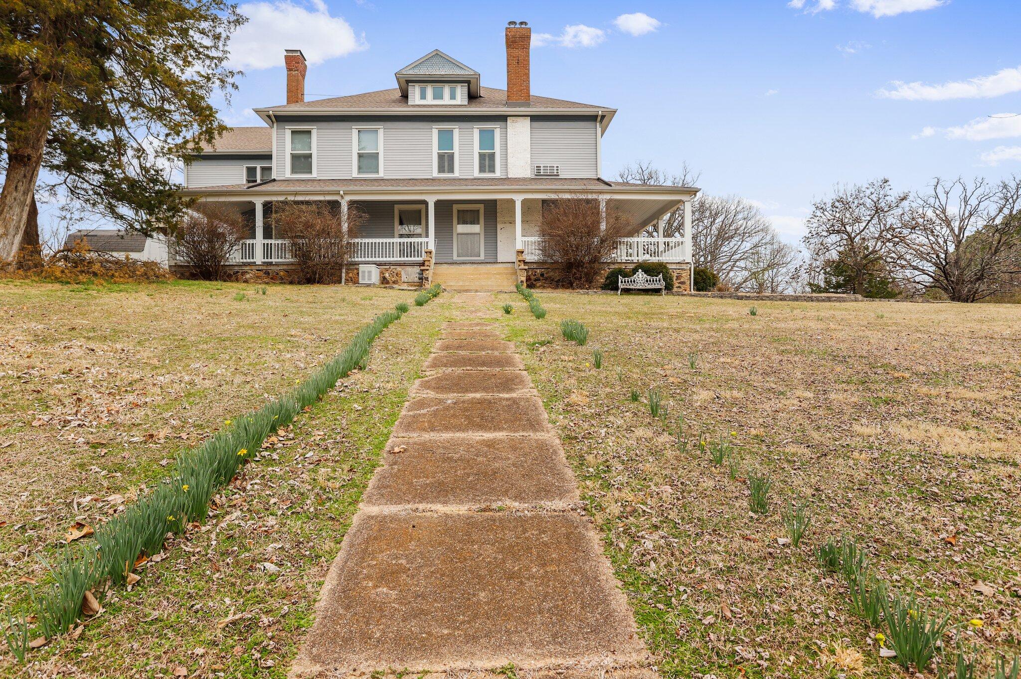 Beautiful authentic turn key bed and breakfast!  Plantation style home on almost 5 acres with five bed and bath suites, one with kitchenette and  the third floor is full living quarters with a view! Each fully furnished room has a Jacuzzi tub and  fireplace! Main floor boasts a beautiful entry with exquisite stairway, study/library, large sitting room and formal dining room for the guests. Plus a Commercial grade kitchen with plenty of storage/pantry space, laundry room and office plus a single room and bath off the kitchen by the back door. Big wrap around deck and landscaped yard for relaxing outdoors makes this the perfect getaway. Also includes a 45x42 Pole Barn on the west side.  All this and around the corner from the West Plains Munipal Golf Course, minutes to town and a short drive to many lakes and rivers in the Ozarks! Beautiful private setting could also be a perfect wedding Venue!