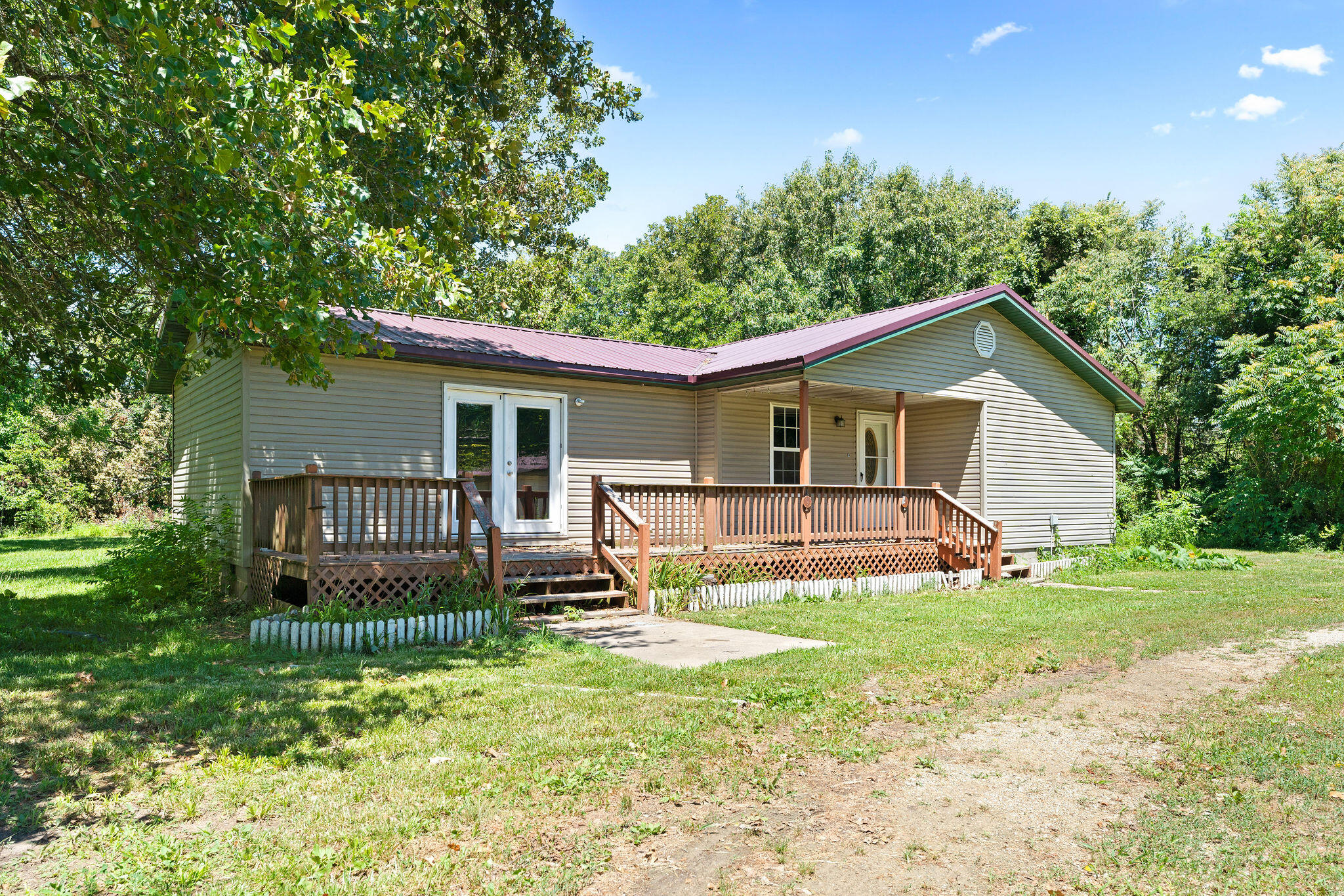 Beautiful 3-Bed, 2-Bath Home on an Acre in Cassville. Just shy of 1,300 sq. ft., this charming home sits on an acre of land and features a detached two-car garage. Located just on the outskirts of Cassville, this beautiful property offers the perfect blend of country living with convenient access to town amenities. The master bedroom has just received new carpet, adding to the home's fresh and inviting feel. Set back from the road, this home provides privacy and tranquility.