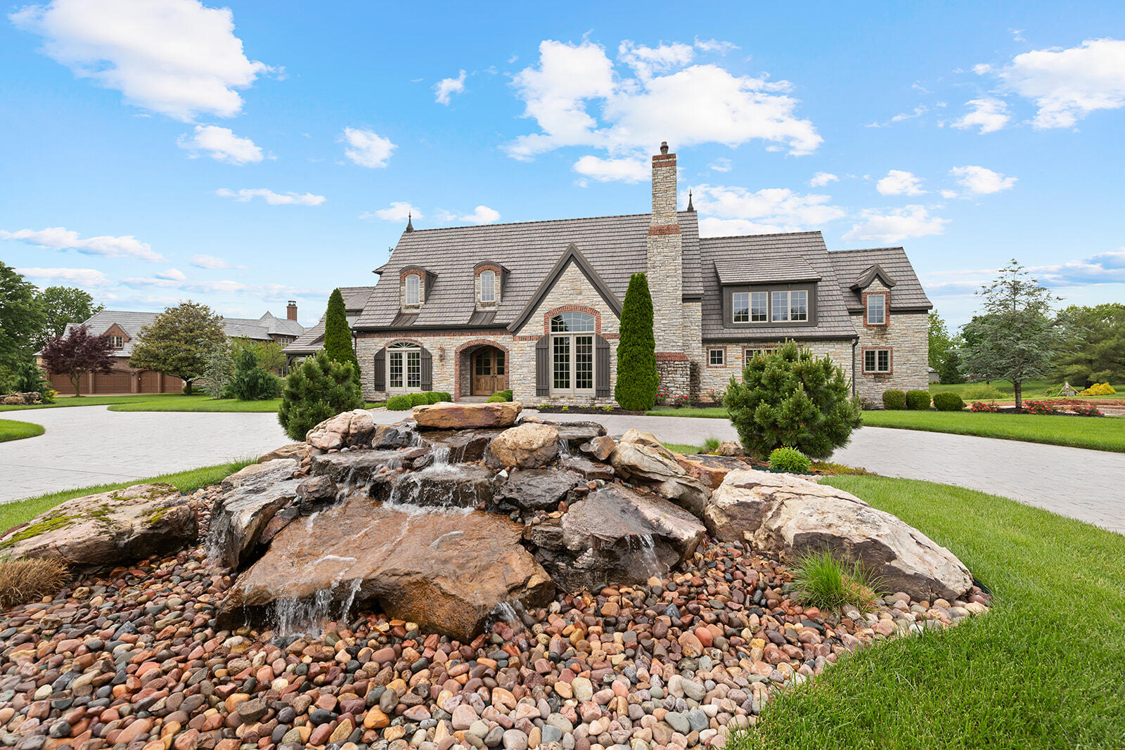 Opportunities like this in Highland Springs do not come up often. Welcome to this absolutely stunning Jack Arnold designed home in the coveted Glen Abbey Phase. Wonderful pond views with fountains in front and back of home. As you drive up you will notice the marvelous stamped concrete circular driveway with custom designed water feature. Mahogany stained double doors lead you into the welcoming foyer with french doors leading right out to the back yard- perfect for entertaining. Formal dining to your left, and a wonderful large Den/Living room to your right with marble fireplace and wet bar. Huge vaulted ceilings as you enter into the kitchen area with commercial appliances. Perfect family dining area with another living room with plenty of windows to take in your view. Large bonus room space above garage, perfect for movie room or office. The primary suite also features large windows to enjoy the pond and fountain in the back. Gorgeous en-suite bath with walk in shower and tub. Large walk in closets with access to down below for storms. Upstairs above the primary suite wing you will find two more large bedrooms both with en suite bathrooms. Pictures do not do this home justice. Take your shot for a hole in one on this one! Do not wait!