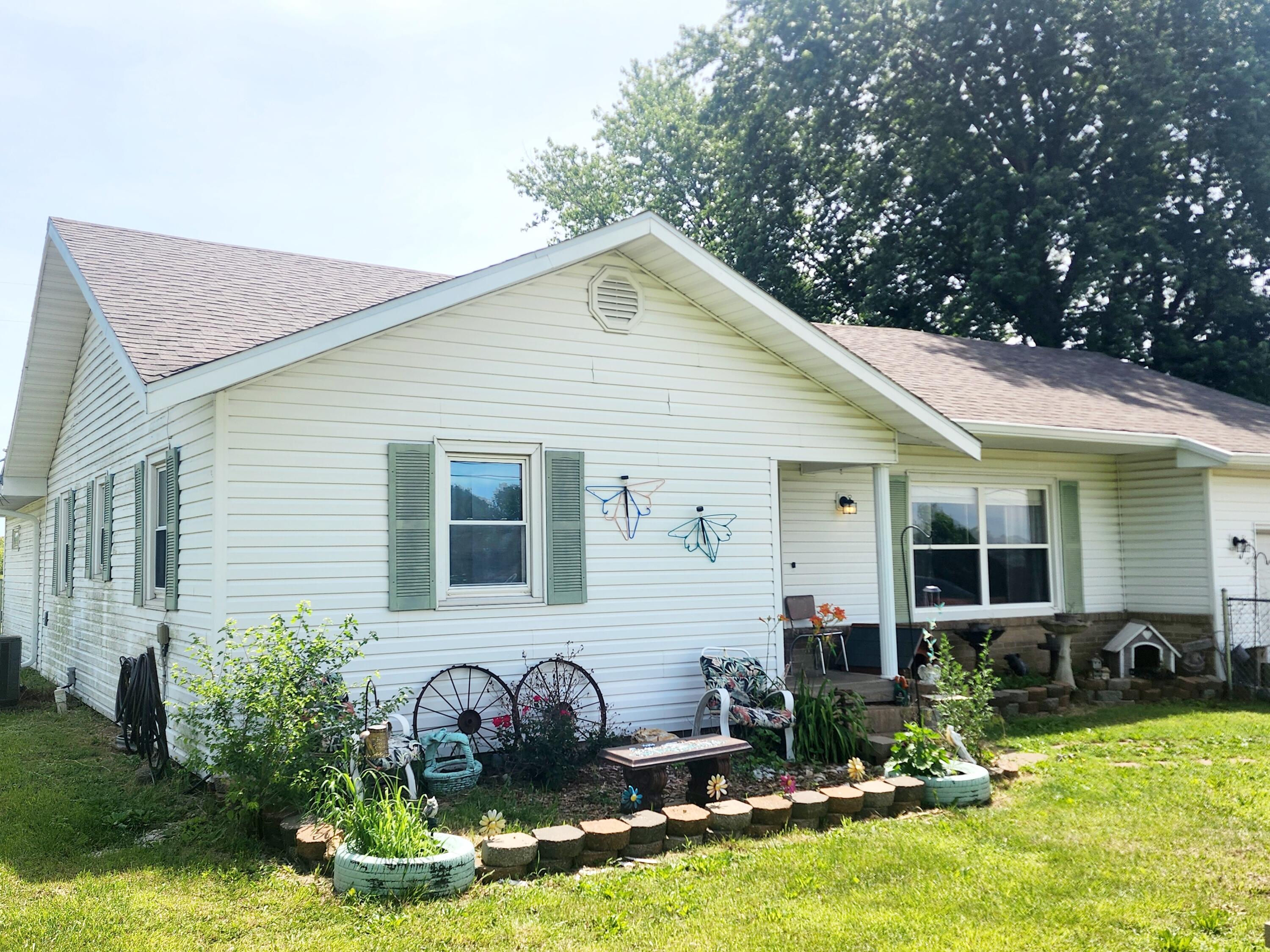 Located in a peaceful neighborhood, this charming 3-bedroom, 2 bath home sits on a generous 1.25-acre lot. The open concept design seamlessly connects the living, dining, and kitchen areas, creating an inviting and spacious environment perfect for family gatherings. Both bathrooms were updated in 2022 and the kitchen in 2020. With ample outdoor space, this property offers endless potential for gardening, recreation, or simply relaxing. A chain-link fence in the front for play area for children or pets. All new guttering on home as well. Call to set up your personal tour.
