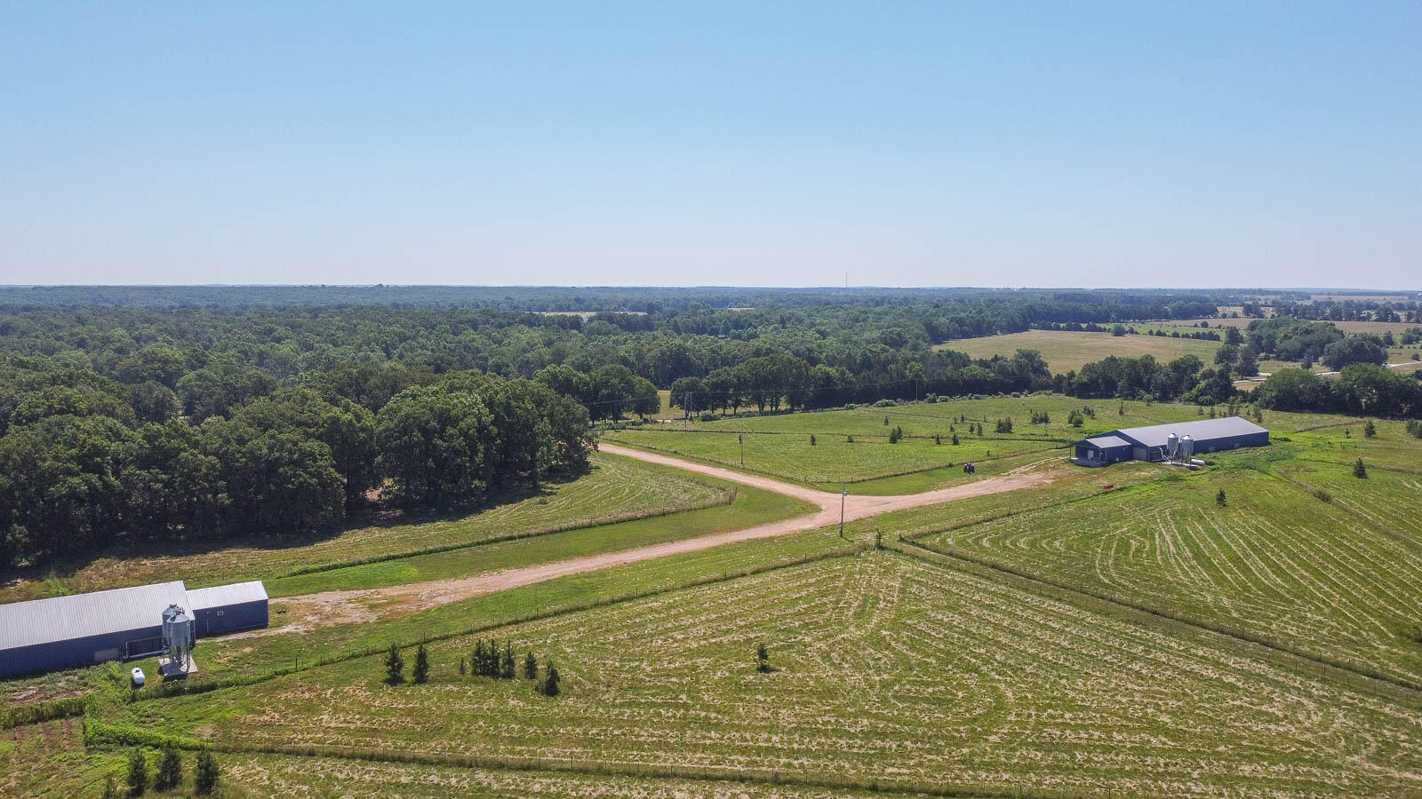 Price Improvement-- This Poultry House Farm on 103.88 ac+/- consists of (2) 50x150' barns built in 2016. Previously contracted with Vital Farms as an organic pasture-raised hen operation. Barns are each heated by a 500 gallon propane tank, have all pex plumbing, feed bins with scales, utilities are Laclede Electric Co-op and private well water. Barn1 includes a cooler egg room and restroom. Gently rolling pasture with a pond and cattle tight fencing, this is the ideal set up for someone looking to run cattle and have a pastured raised chicken farm. No dwelling, but plenty of building sites for future owners and room to expand the business. Buyer to secure Poultry contract.