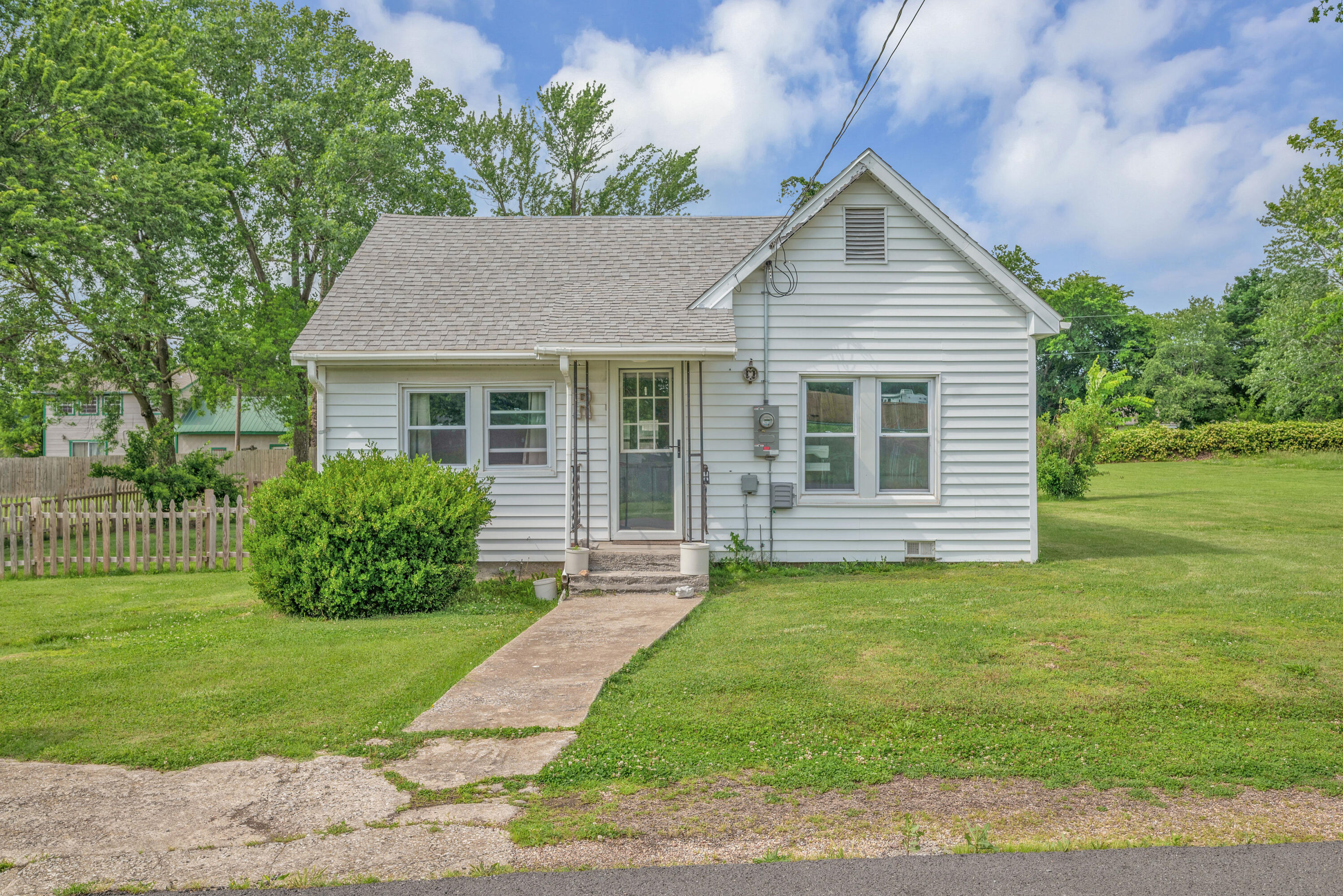 Step into this Pinterest-perfect home and experience a blend of timeless charm and modern comfort. This charming 2-bed, 1-bath bungalow boasts a wooden beam in the living room and beautifully restored original hardwood floors. A new roof installed in 2017 and a complete remodel just two years ago ensure modern comfort and style. The cute picket fenced backyard offers a safe haven for your pets to play, while the property's large double lot provides ample space for outdoor enjoyment.   - Meticulously Restored original hardwood floors  - BRAND New roof installed in 2017  - Completely remodeled just 2 years ago for a modern, light - airy look!  - Large eye-catching Wooden beam in living room  - Cutest picket fenced backyard, perfect for pets!  - Sits on a sprawling double lot--big enough for someone to expand or add a garage or shop!Loan Qualification: Eligible for FHA, RD/USDA, VA, and Conventional loansWorks perfect for a first time home buyer, someone looking to down size, rental, Airbnb.. the opportunities are endless with this cutie!