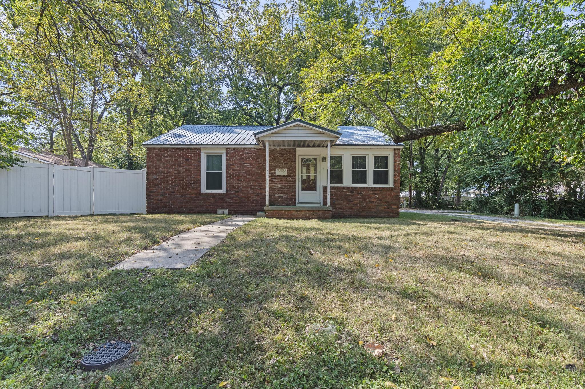 Back on market due to previous inspection issues. Home sold as-is. Seller will make NO repairs.  Previous inspection available but no offers will be accepted that include further inspection contingencies.  Please do all due diligence prior to making an offer.All brick home just around the corner from Evangel University, OTC and Drury! Would make a perfect first or downsizing home or would be great for a rental or student housing! Why rent your kids someplace to stay when they're in school when you can have something to build equity in for less monthly cost?  Updates include thermopane windows, a metal roof, six year old furnace and hot water heater and more! Other features include a fenced yard, two car attached carport and white, painted kitchen cabinets. Don't wait, call today for your private tour!