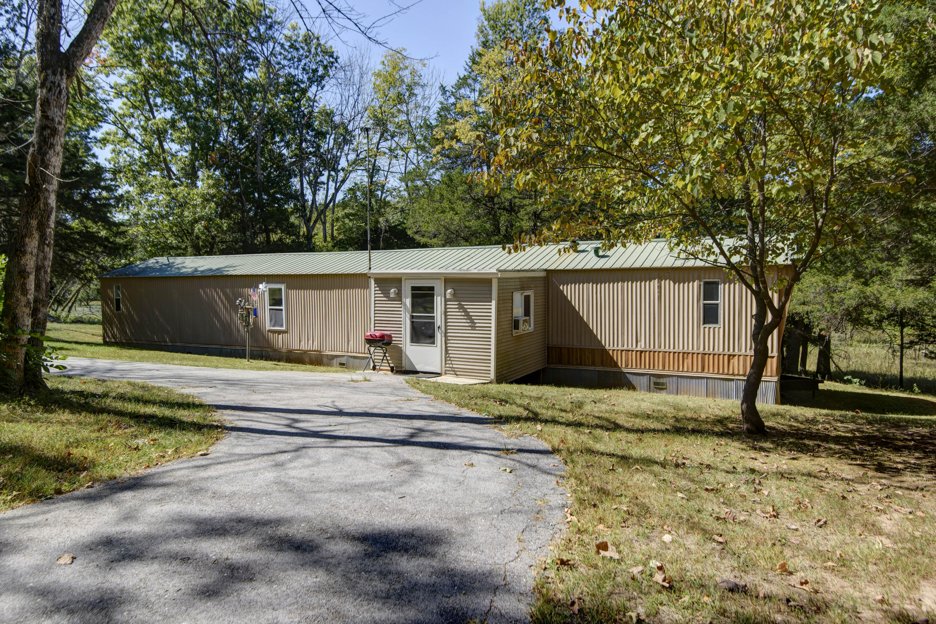 Welcome to 951 Cedar Ridge Road. This 3 bedroom 2 bath home features nearly 4 acres of secluded rural land, mature foliage and lots of space to build.