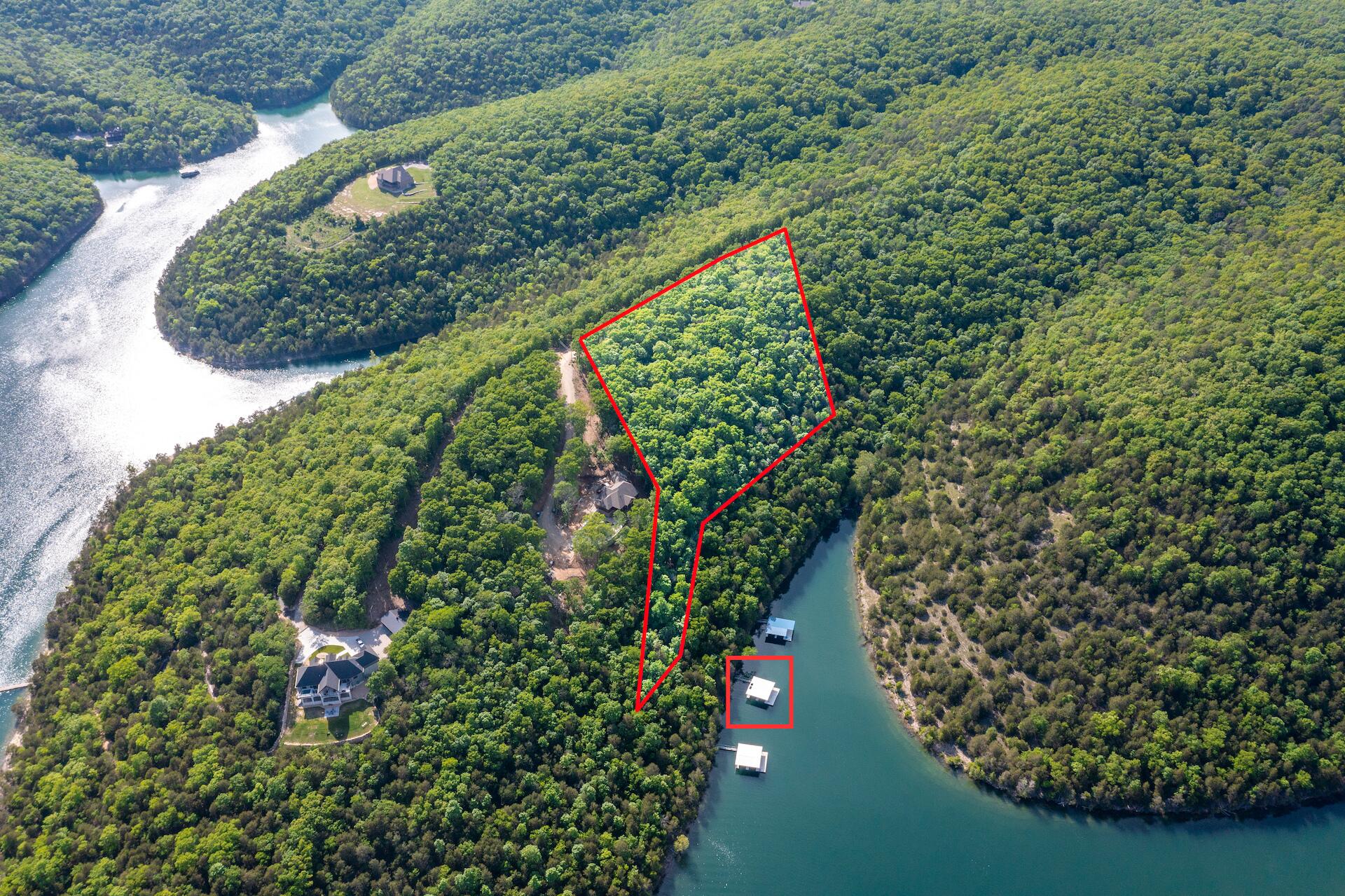 Welcome to your lake lover's dream home-site! This 5 acre lakefront gem has a 2-slip PRIVATE dock (with swim platform) available for only an additional $100,000!!! Once cleared, the ideal build site will offer million-dollar year-round views of Table Rock Lake from your back deck. Quiet and secluded, yet a brief 10-minute drive back to Kimberling City for all your needs. Also, this lot has no building restrictions....What are you waiting for?!