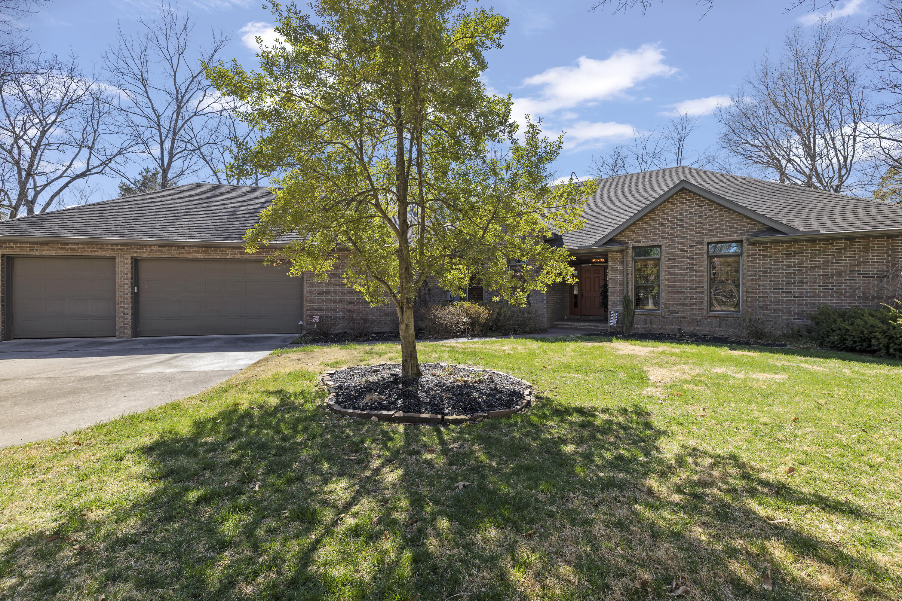 Quality, professional, high end, all brick home with all the bells and whistles nestled on 10 wooded acres. Priced to move! New Kitchen! New Cabinets! Gorgeous granite! Beautiful Plantation Shutters! New hardwood floors. Custom propane fireplace with Smart Control. Lots of closets and storage. Master bath offers his and hers walk in's and a claw foot soaking tub. Excellent space for entertaining on the large screened in porch. Brand new 6'' gutters with premium gutter guards. Custom landscaping and irrigation. Standby propane generator, that will run the entire house. 420 Sq ft shop with electric, oversized 3 car garage! Tornado shelter in the garage! Dedicated RV hookup, a 20x25 garden plot as well as a 10x30 black raspberry patch, and much, much more.Prequalified Buyers only! Cash buyers will need proof of funds.