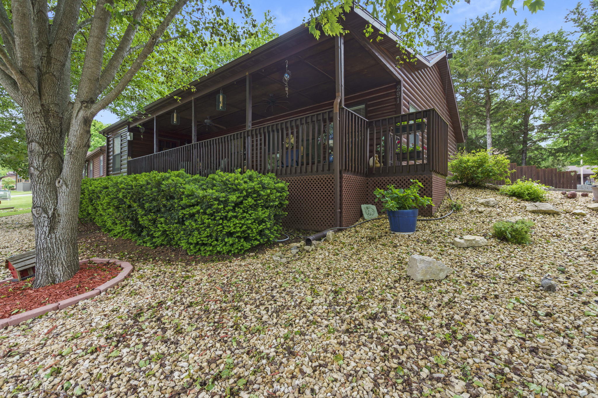 Welcome to this adorable one story home in Pine Woods Village! 291 Valley Stream Circle is nestled in a quiet corner that provides privacy through trees and an 8 foot privacy fence. The lot is all rock making it completely maintenance free! As you pull in the driveway you'll notice the large covered front porch and only one step up for entry. Walking into the home, you'll find an open concept living area, all new flooring throughout, a moveable kitchen island/bar, modern light fixtures and unique quartz countertops in the kitchen. This home has been recently painted with a brand new HVAC system installed. Both bathrooms have been completely updated and offer walk in showers! 291 Valley Stream Circle is in the Hollister School District, minutes away from Table Rock Lake and still close to Branson attractions. The backyard features a second covered sitting area and large storage shed! There is even a second entry into the southeast bedroom. With all this property has to offer, you must see for yourself!