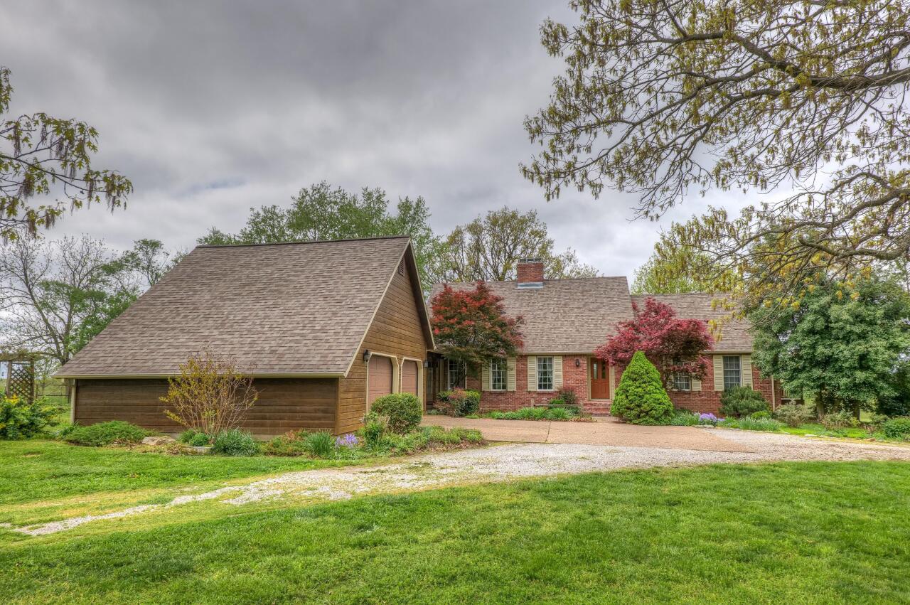 A real Quiet & Pretty Place!  3020sqft brick southern colonial home on 37.14 lush acres, with pool house, in-ground pool, 40 x 56 barn, 2 wells all in  remote location for plenty of privacy. Custom Home built in 1999 features: 3 bedrooms, 4 full bathrooms, Large country kitchen with island, 19 x 13 mudroom with full bath, 2 car attached garage, 3 finished basement rooms for office, family room, non-conforming 4th bedroom....you decide. 2nd floor loft is a great place to sit and think, so is the main floor sun room.  All in all this is a lovely home....just like the one you have dreamed of.  Master suite is on the main floor.  Lots of large windows provide natural light, two gas-log fireplaces for beauty and warmth, formal dining room for large gatherings, this is just one of those must-see places!  Make your showing appointment today.