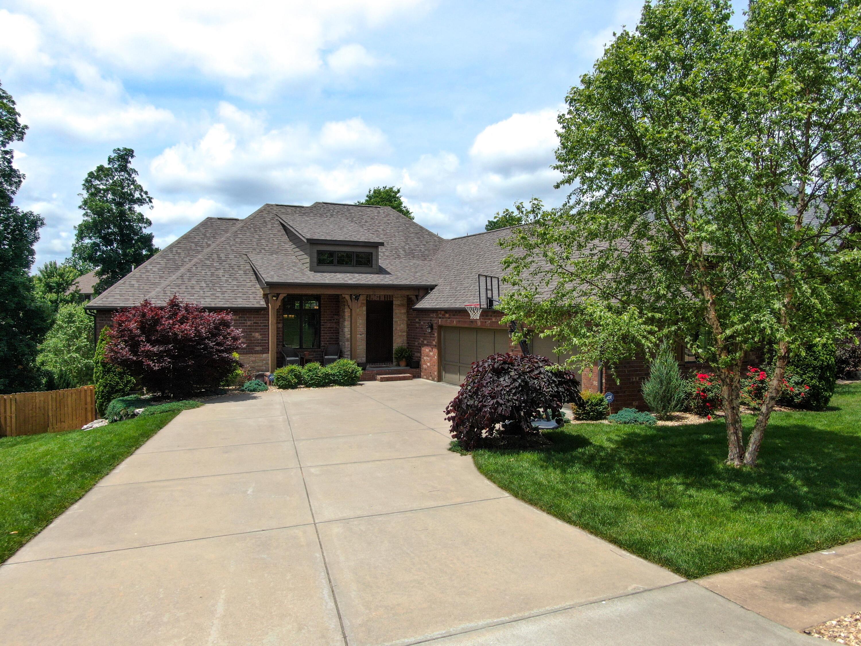 Beautifully designed, quality built (Elite Homes by Keith Mckee) all brick walkout basement home in a superb location within Olde Ivy. Easy access to the Nature Center and so many Springfield activities, hot spots and shopping. The open floorplan, large basement living/rec room with built in bar, patio, covered/screened deck and terrific back yard are perfect for entertaining. Solid surface counters throughout, large kitchen with island, gas cooktop, walk-in and separate butlers pantry. Sprinklered lawn front and rear, mature landscaping, John Deere Room for gardening supplies and additional storage building. Garage is hard wired for an electric car charger. Home has outstanding storage.