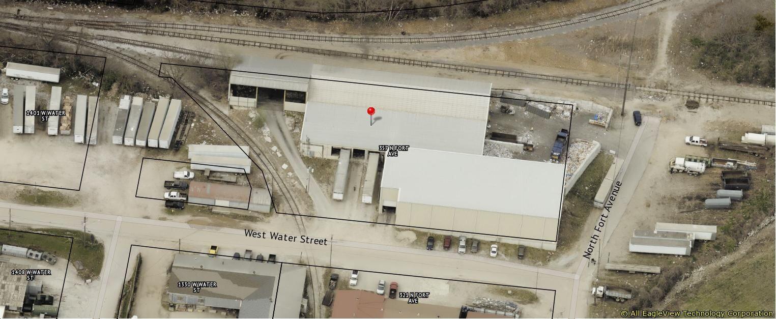 29,530sf under-roof railroad served industrial facility on 1.05 acres, zoned Heavy Manufacturing, and previously used for residential recycling.  Buildings: #1 is 10,030sf, built in 2008, roughly 158 ft x 65 ft with 26 ft sidewall height, with 400 amp 3-phase electrical service, grade level access that includes a 12 ft x 16 ft door, and a large opening to the fenced exterior concrete paved area.  Building #2 is a 16,000sf, 160 ft x 100 ft building built in 1965 that is 1/2 clear span with a gable roof with 12 ft sidewalls with 2 RR docks; the remaining area has a shed roof with 11 ft sidewalls with 3-4 truck docks, and 400 amp 3-phase electrical service.  Connected to this building is an open utility building of 3,500sf, clear span.  All buildings have concrete floors and are not heated or insulated.  A 10,600sf fenced concrete paved area connects the two buildings.  BNSF services the property with approximately 320 ft of rail spur, enough room to spot 3 RR cars.  Springfield City Utilities, 417-881-8888, provides all utilities.  The 2024 property taxes are $9,859. Listed for sale; $749,000 or $25.36sf.