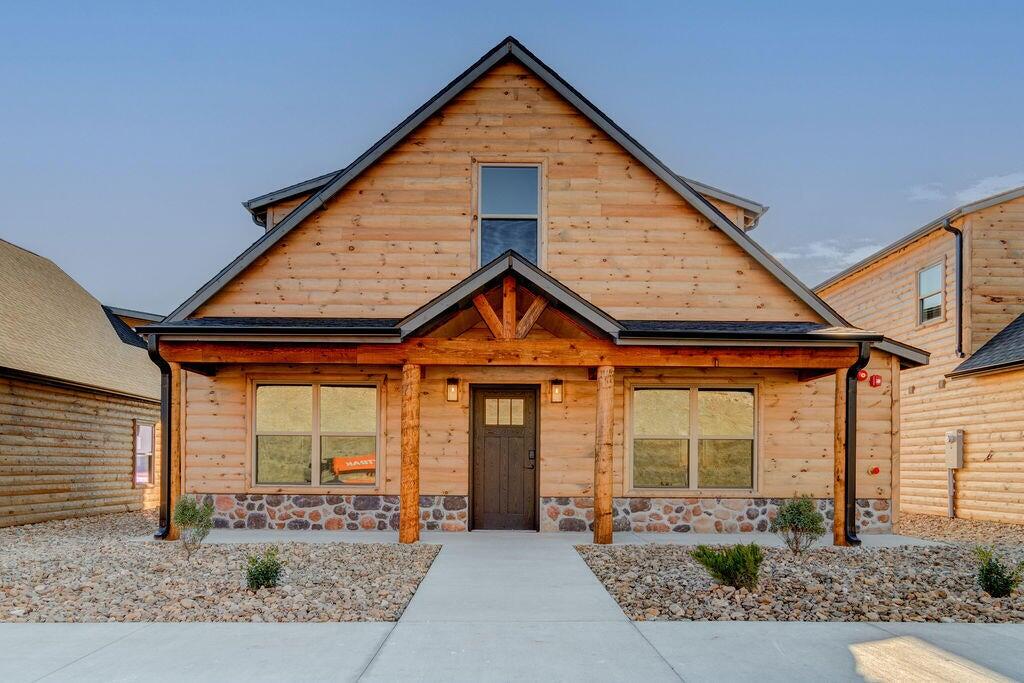 Welcome to Lakeside Cabin Bliss - Available Sooner Than Expected! This delightful 2-story cabin, set for a 2024 debut, is now ready to be your new home. Boasting 4 cozy bedrooms and 4 sleek bathrooms, it's perfectly positioned near Highway 265, offering mesmerizing views of Table Rock Lake from both levels. The cabin fuses rustic appeal with modern comforts, creating an inviting atmosphere for relaxation and style. Ideal for night rentals with no management limits, it's a wise choice for investors. Close to the calm of the lake, the buzz of Branson, and the fun of Silver Dollar City, it offers a lifestyle that's both serene and full of excitement. Don't miss this early chance to dive into premium cabin life