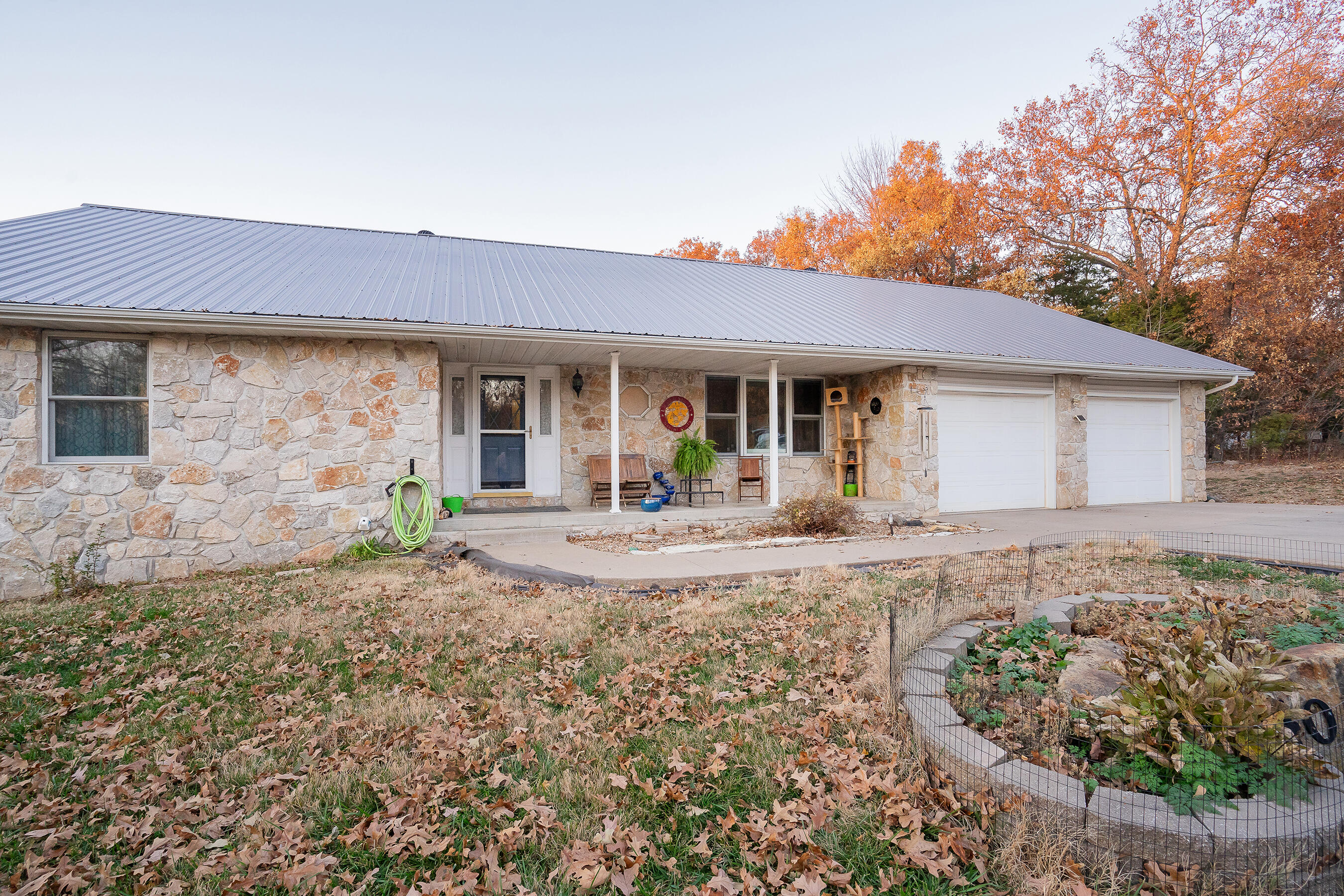 Beautiful home sitting on 10 acres of open and wooded land! There is a stocked spring-fed pond for fishing, along with several additional structures on the property including a shop with a lien-to and a converted chicken coop. Full Rv hookup with carport. There is a new lifetime roof that was put in under a year ago, storm shelter, new water softener and so much more! Home just needs solar to be completely off-grid!