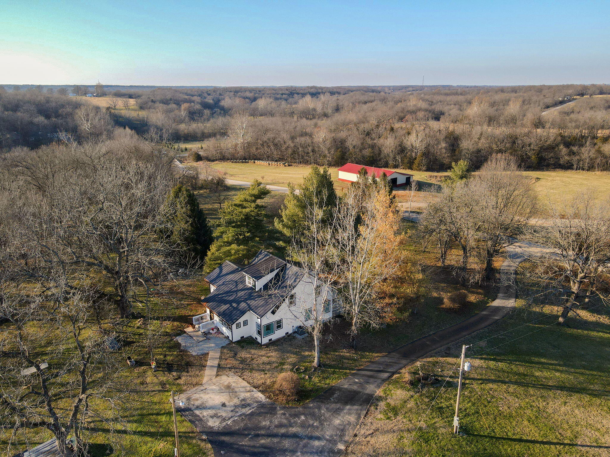 Prepare to be impressed. This home has been taken down to the studs and has been totally redone. High end, everything from light fixtures to bathroom, faucets, and everything in between. It is very impressive. Three bedrooms 2 1/2 baths. Over 2200 ft. setting on almost 10 acres. Granite countertops. Custom cabinets. Stainless appliances. Re-purposed wood in the entryway and they also made a fantastic kitchen table. A nice barn that is 28 x 80. Great for horses, and all of your animals. There is also a 30 x 50 tractor barn. This is a great hobby farm. You don't want to miss out.