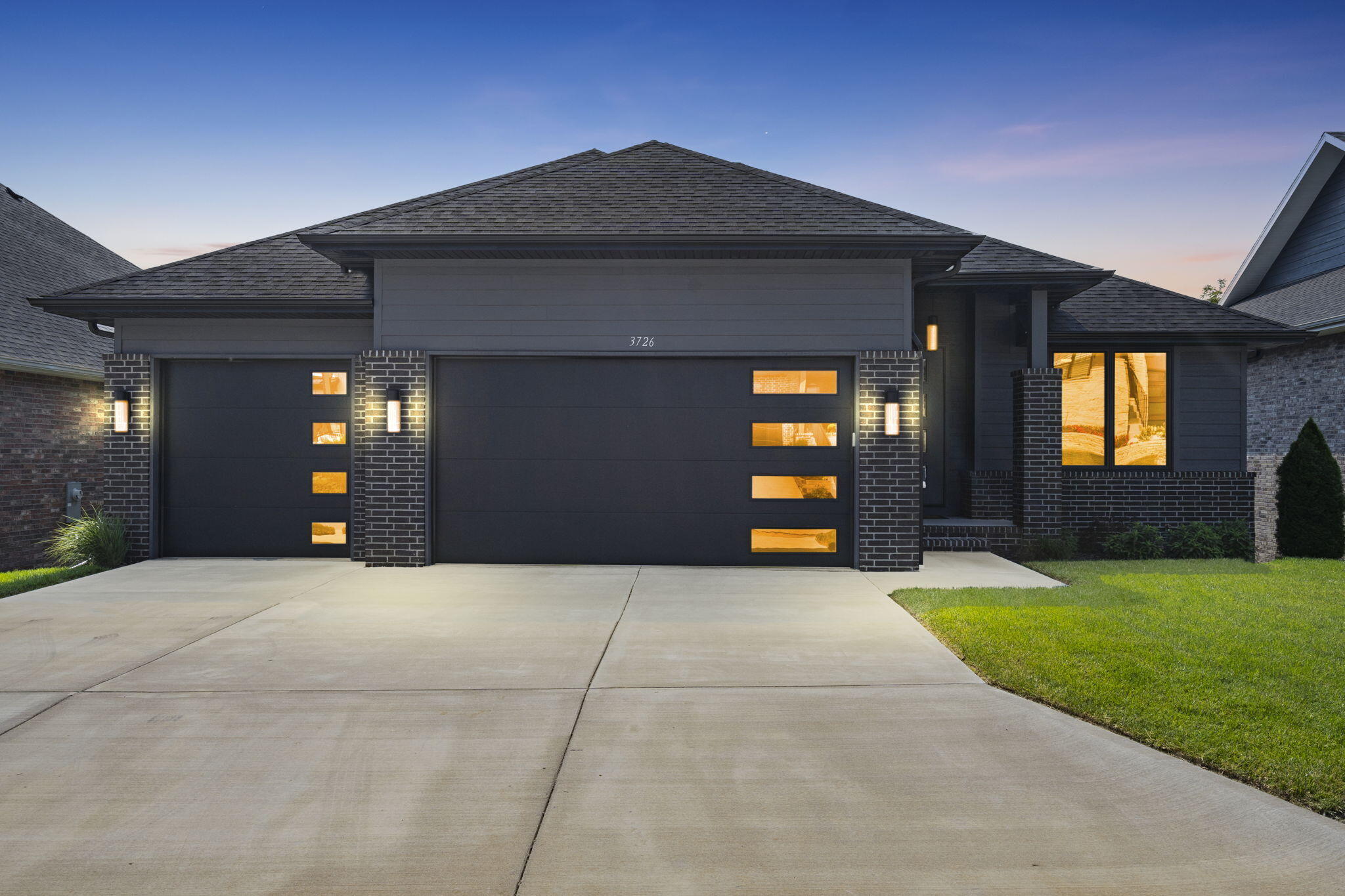 Step into a world of luxury and sophistication! This immaculate home redefines high-end living with its top-tier finishes, set against an ideal location. As you enter through the grand foyer, you'll be greeted by stunning luxury vinyl plank floors that guide you into an expansive open-concept living room. A floor-to-ceiling fireplace and custom built-ins create a statement centerpiece.The kitchen is a masterpiece, showcasing an oversized island, breakfast nook, top-of-the-line appliances, and a generously sized walk-in pantry.The main floor houses the master bedroom, complete with a luxurious master bathroom and an irresistible walk-in closet!Downstairs, you'll find all the space you need, featuring a second living area complete with a wet bar, two additional bedrooms, a full bath, and convenient walk-out access.Outside, the property offers a serene deck, a charming patio, and an expansive open lot that invites creativity in landscaping. This home resides within the exclusive gated subdivision of Hickory Hills, and is now looking for new homeowners!