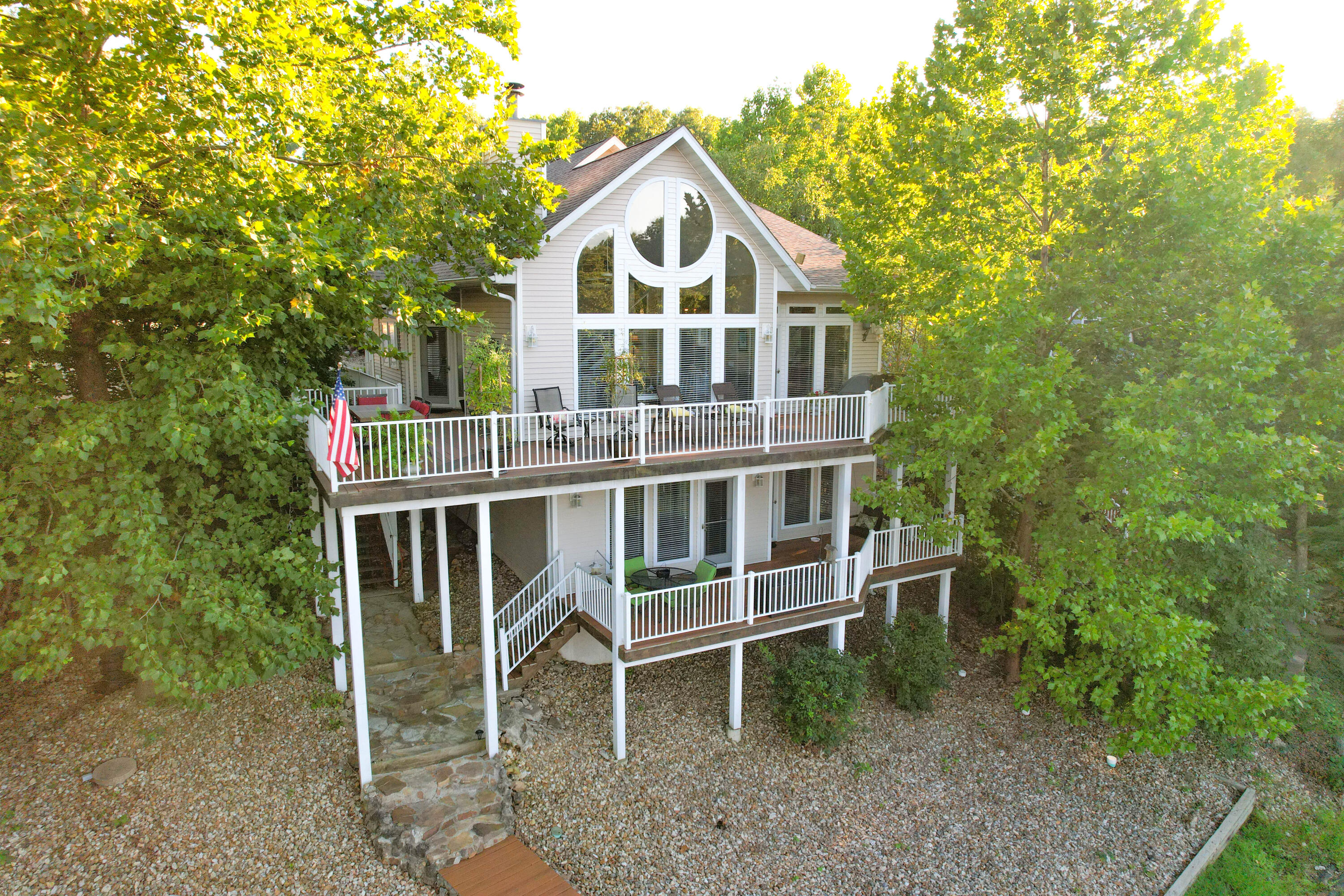 Lake home for sale Camdenton Missouri4 bedroom 3.5 bath home overlooking Jackson Cove in the Little Niangua arm of Lake of the Ozark. This beautiful 2968 square foot home, built in 2004, has large vaulted ceilings, two main suites, newly remodeled kitchen, and wonderful views of the lake. This home is move in ready with new floors installed in the main living area installed 3 years ago, new roof, appliances, HVAC system, and new deck all updated within the last 3 years. Enjoy the Winter months withthe warm pellet fed fireplace. Enjoy the summers on this two tier deck made with lifetime warranty Timbertec wood. Home has a heated oversized 2 car garage attached. All appliances stay with turnkey furnishing options. Located in Camdenton School district, the taxes for 2021 were approximately $1,903.00 and has HOA fees of $500 per year. This home can also be aninvestment opportunity with rental options allowed.Fishing property Lake of the OzarkEnjoy the summers on the 2-slip boat dock with swimming extension. Dock sizes are 10x24 and 10x20 to fit your fishing boat and pontoon. Lift for pontoon stays with property. Dock is completely up to Ameren code. Located on the little Niangua, Catfish and Crappie are caught during all times of the year here with crappie beds surrounding the dock. Jet ski and Jet ski liftare available for additional cost.Camden County PropertyThis property sits on 0.4 +\- acers in a quiet cove in Lake of the Ozarks. Many restaurants are minutes away and lake front restaurants near by to boat to during the summers. Shopping, Lake Regional Hospital, and entertainment is just a short drive from this home.