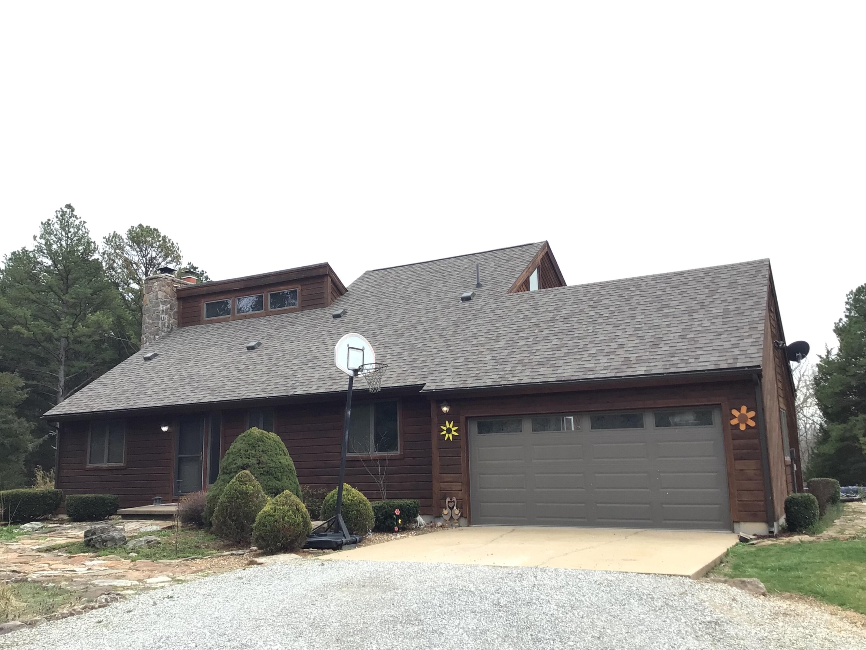 Beautiful 2 story Cedar Home with full basement on 78.5 Acres m/l! Located near  national forests, Big Piney River, and Boiling Springs and not too far from Rolla, MO with Hospital, shopping and restaurants.  Main level features dining/kitchen combo that opens to the living room. Living room with a rock fireplace, large windows, cathedral ceilings; also, 2 bedrooms and 1 bath. Master suite with vaulted ceilings and bath with walk in shower on second story offers its own private deck! Electric lift chair to Basement that features family room with a rock fireplace, 4th bedroom, 1 bath, large storage room with walkout covered patio. Home would work well for extended family living with living space in basement. Washer & dryer hook ups also available on main level off the attached garage and downstairs in storage room. The 78.5 acres m/l offers Shed building with wood burner and electric, perfect for storing your recreational toys, barn for livestock and pasture land for livestock, wooded acreage for hunting,  2 ponds - 1 stocked for fishing with floating private dock. RV Hook-up.Private country setting with long driveway lined with pine and cedar trees. Windows bring the outdoors in!