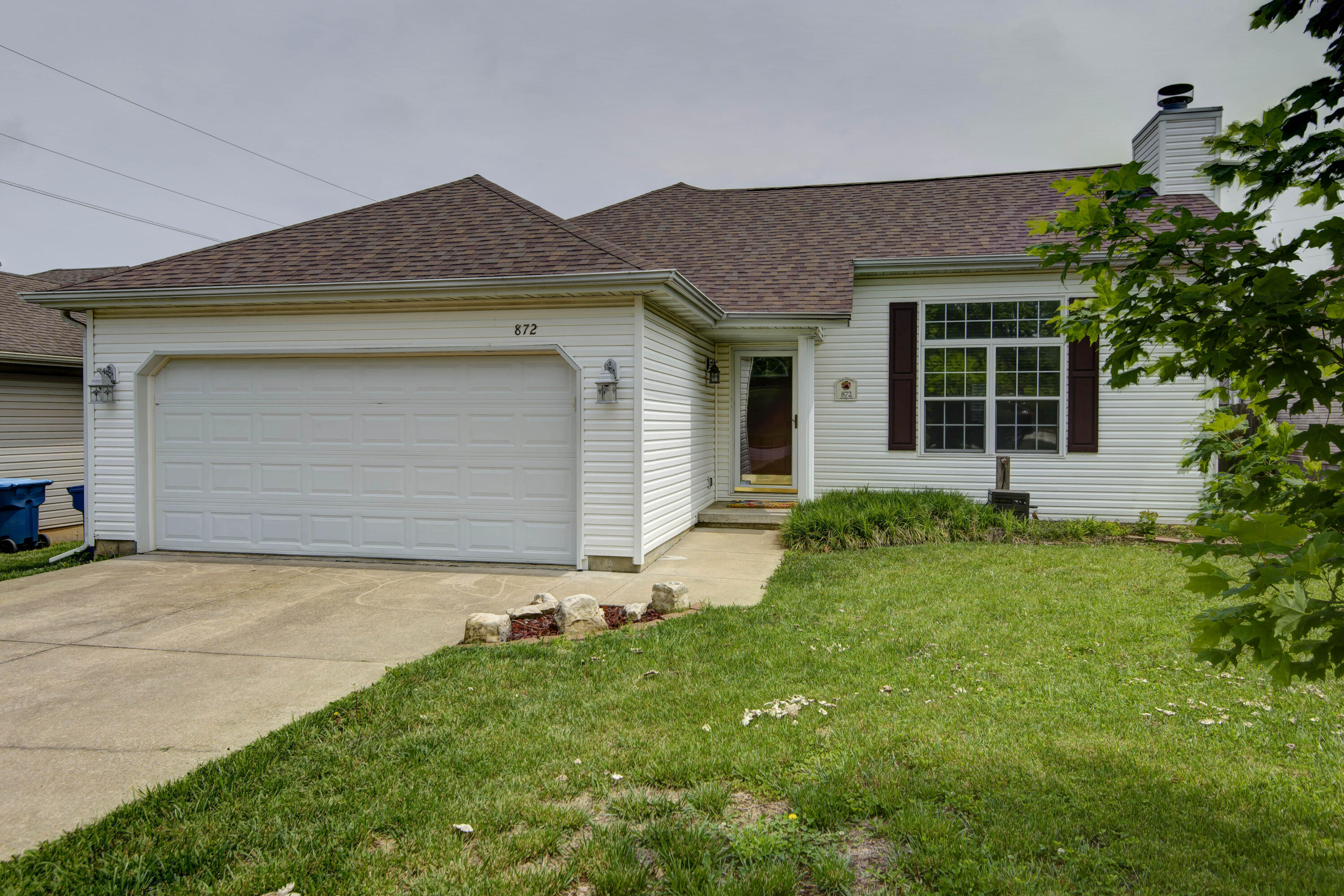 Light and bright with vaulted ceilings and an open floor plan, pretty hardwood floors and a gas fireplace. Bedrooms have new carpet with premium pad and very large walk in closets. HVAC is still under warranty with Larson Heating and Cooling. Roof 3-4 years old. Refrigerator, washer and dryer stay!