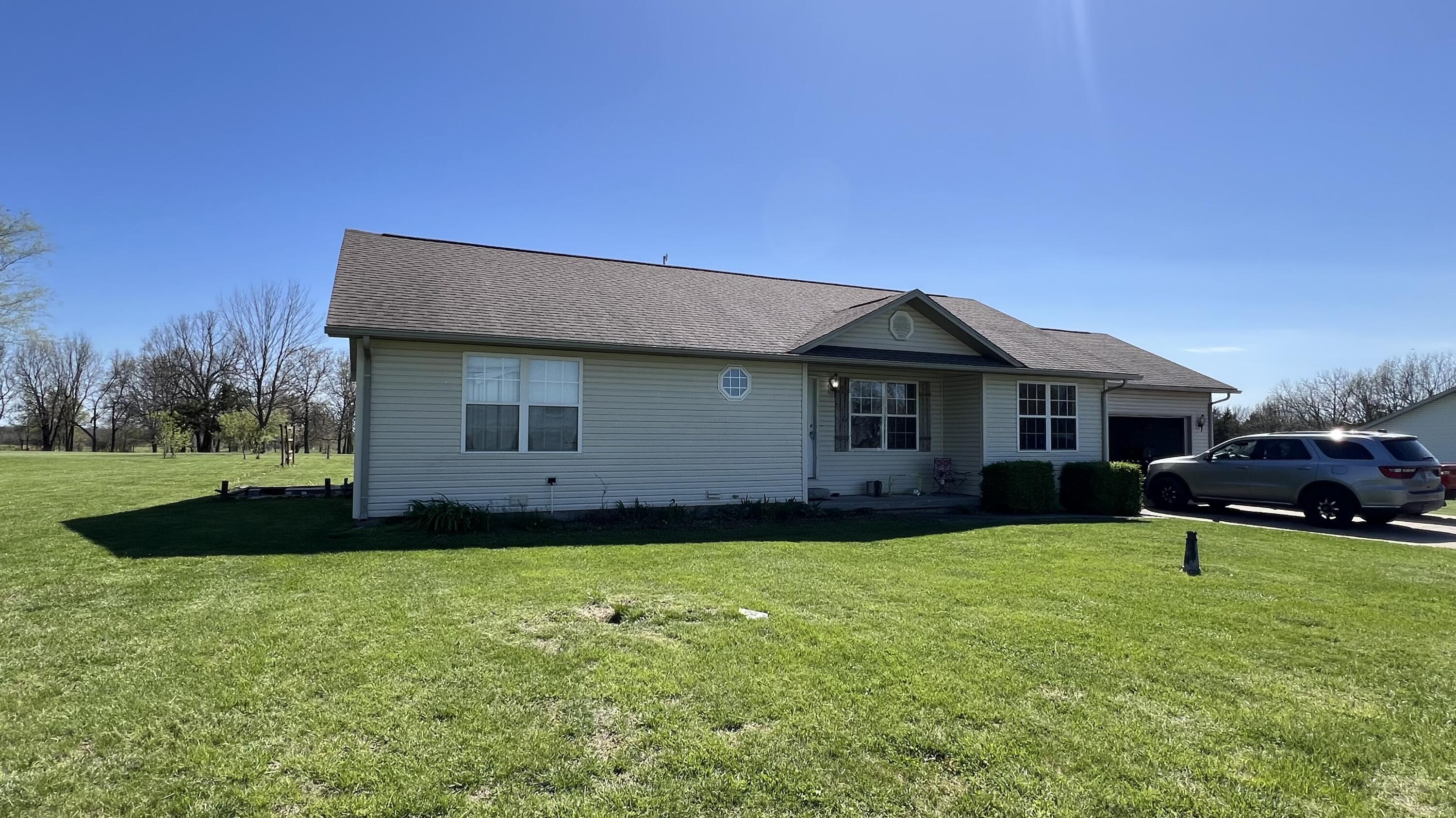 Check out this 3 bed 2 bath sitting on 2 acres just outside city limits. Includes 2 car attached garage and central heat/air.