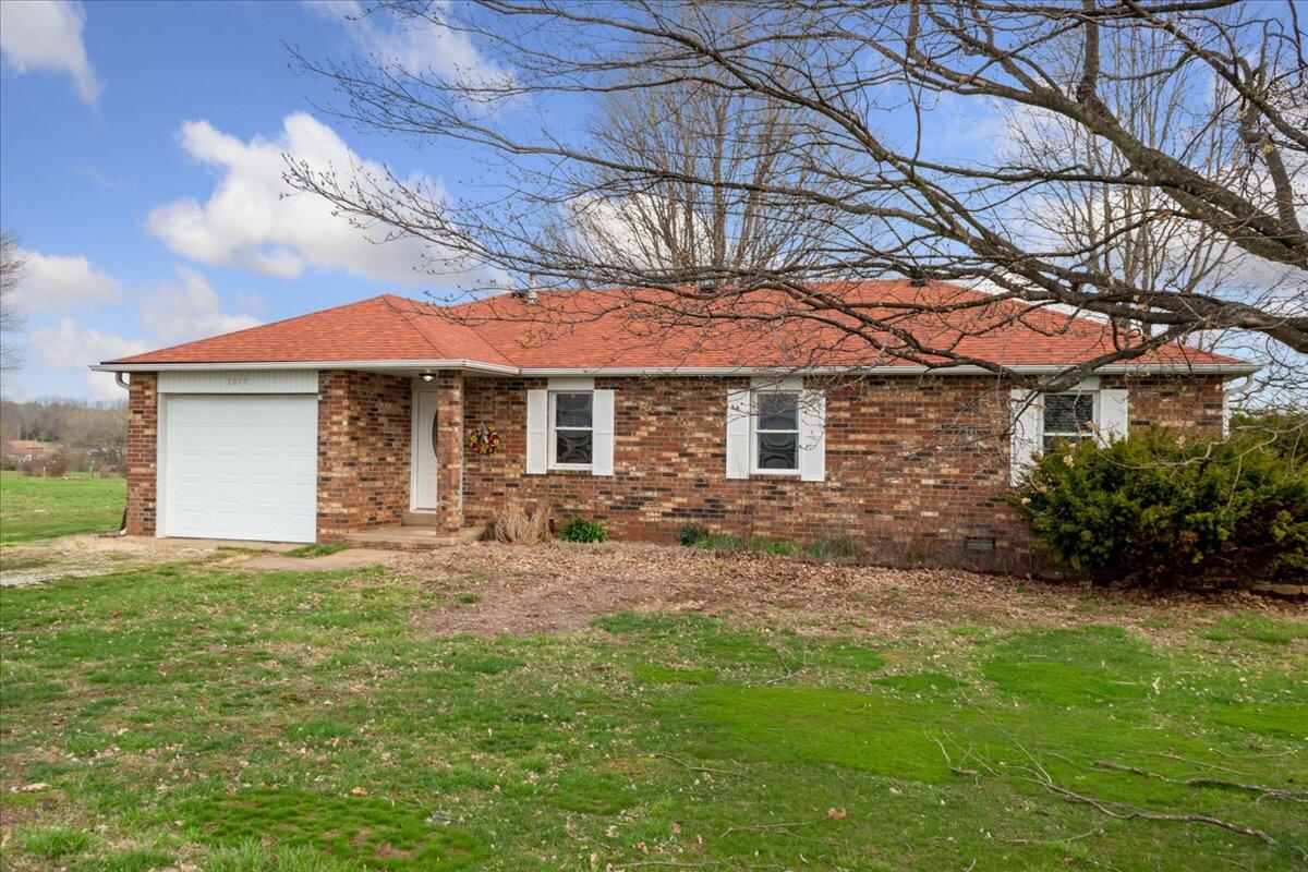 CUTE ALL BRICK HOME ON 10 ACRES.... IN WILLARD SCHOOLS!!!Say Hello to this adorable ranch style one-level home. Offering 3 nice sized bedrooms, and 2 full bathrooms. The living and dining areas are large and open to the kitchen, making a great entertaining space. The laundry / mudroom is off the garage, with backyard access making it a perfect drop zone when coming in from taking care of all your animals out back. The acreage is fenced with a pond that is wet year round, for your livestock, horses and cattle allowed. There is a 12 x 24 storage shed with electric and water pump nearby perfect for goats or chickens. There's already a raised garden bed started, bring your things and enjoy the country living with a short commute to shopping, etc. Truly a beautiful property, this home would make a great investment as it has many opportunities for upgrades and personal touches. A blank slate to make it what you want... call and schedule your showing today, I promise you won't want to miss out on this one!!!