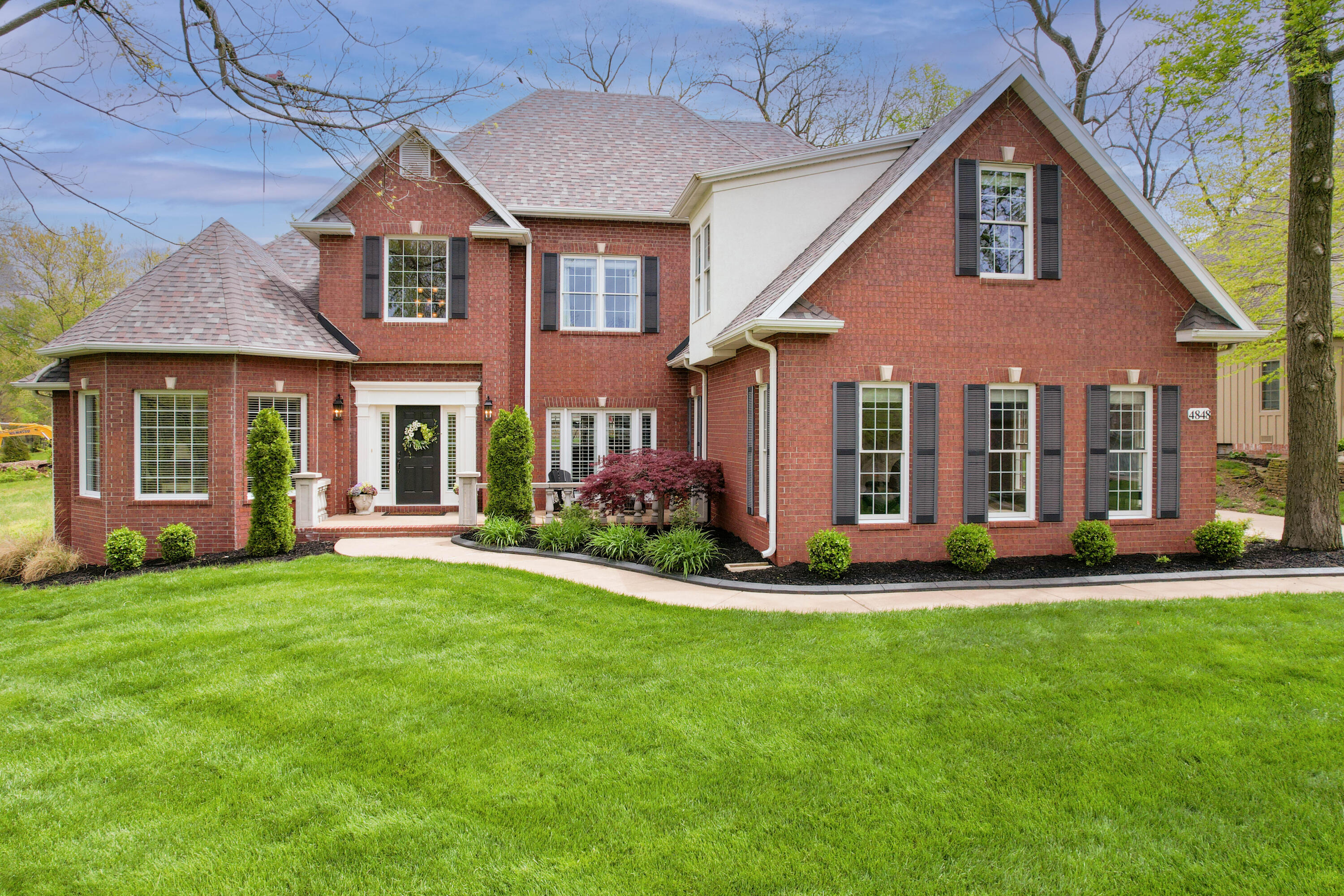 Experience the security & beauty of Timberbrook, a Gated Community in South Springfield offering peaceful serene park, meandering walking trail, bridge, creek, ponds, fountains & gentle relaxing sound of moving water. Conveniently located 3.5mi to Cox South Hospital & Medical Mile, 1.3mi to Wanda Gray Elem, 2.4mi to Cherokee MS, 3mi to Kickapoo HS & 1.5mi to Hwy 60 access. This Beautiful All-Brick One-Owner home with new roof in 2019 has 4+ living areas, 5 bedrooms, side-facing 3 car garage in back of home, substantial room sizes perfect for large families & Multigenerational living. Beautiful spacious Kitchen is well-appointed with large Island/Breakfast Bar, stainless steel Whirlpool appliances, newer Bosch dishwasher, efficient design, plentiful granite counterspace, generous storage, Pantry & smooth flow pattern to Rec Room, Hearth Room & Living Room for daily living & entertaining. Kitchen/Dining Combo is spacious, inviting & opens to side concrete patio. Laundry Room is located adjacent to Kitchen for convenient access. Master Suite is welcoming with two large walk-in closets: original closet accessible from Ensuite & former office converted to Custom Walk-in Closet with built-in adjustable shelves, hanging space, sitting area & rolling library ladder for upper storage. Double tray ceilings & crown molding add to ambiance of Master Suite. 5-fixture Ensuite includes dual sinks/vanities, jetted tub, standup shower, private commode & original walk-in closet. Abundant natural light warms this home year-round bringing the lovely outdoors in. Plantation shutters & horizontal wood blinds define windows with style creating a unique look while providing variable light control & helping insulate rooms against heat & cold. Rec Room adjacent to Kitchen with direct access to side driveway is conveniently located & refreshingly large perfect for entertainment systems, playroom...(click more)