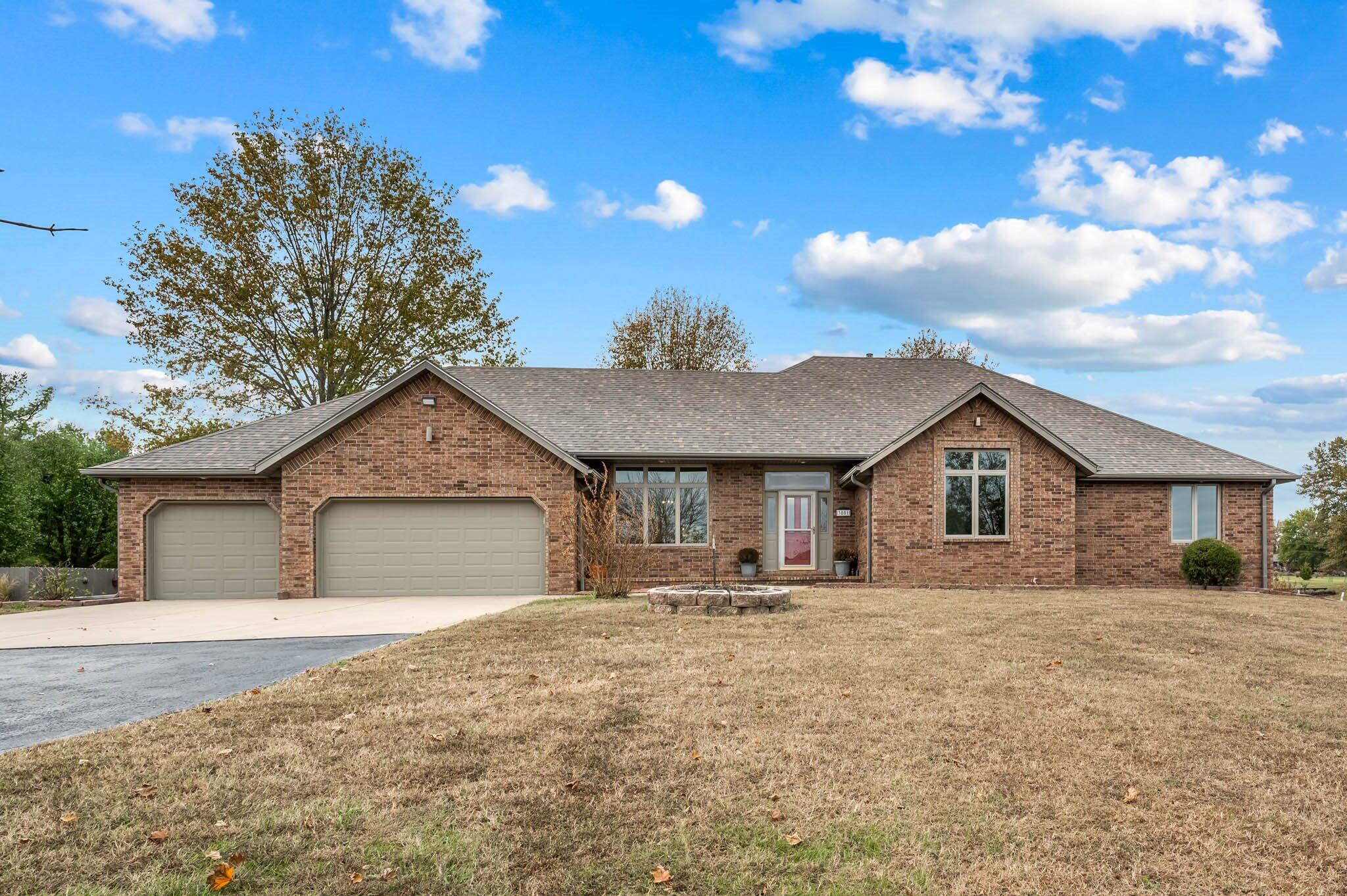 Great Ozark location! All brick walkout basement home on 2.38 acres with a 36x60 heated outbuilding. Brand new Pella windows, new GE Profile stainless steel appliances, new hickory hardwood flooring and so many nice features! Over 2,700 sq ft on the main level and a full walkout basement with a wet bar. New roof on the home and shop just installed this year. This home is quality built, nicely maintained and move in ready. Properties like this are hard to find! Owner/agent