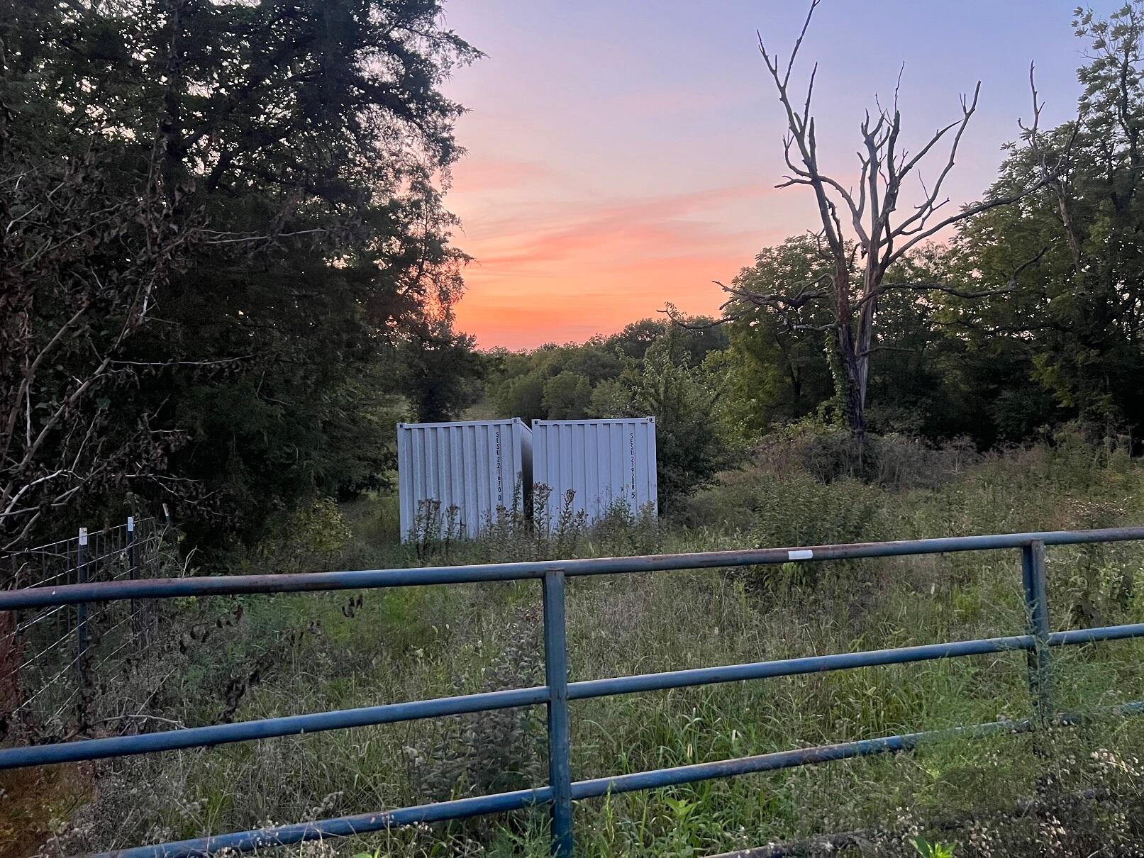 Gently rolling land, lots of places to build. Gates on Farm Road 35 and 39. The one on 39 is unlocked. Keep it closed at all times. There are 2 Storage Containers set at property that convey with property. Mix of pasture trees and scrub. Property has beautiful spring fed creek and boarders Nathan Boone Conservation Area. SE corner is about 1900 feet from Farm Road 64 on Farm Road 39, and the SW corner is about 8500 feet from Farm Road 64 on Farm Road 35. Both storage containers are new and they convey with the property. They are empty and locked.
