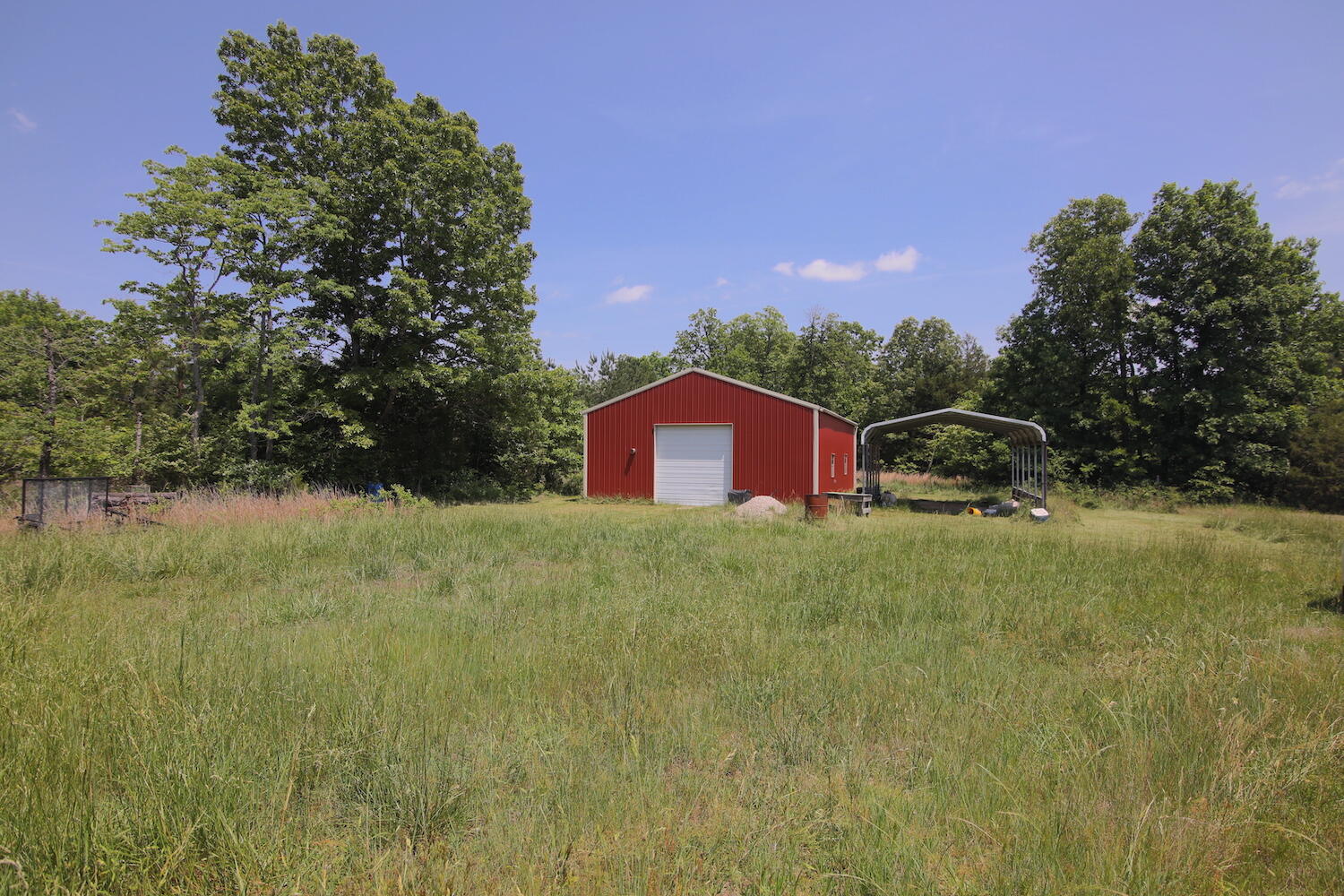 Farm for sale in the Ozarks. This 145 m/l acre farm is fenced. Property is about 1/3 open and the balance is wooded. It is located just minutes from the small town of Thayer, MO. This farm does have an older home on it that has been stripped down to the studs; ready for you to finish it out! Also a detached garage sits right next to the house. Home also has a partial basement with a walkout. Large shop building, 30x40, comes complete with concrete floors and electric running to it. Property has several mature trees. The home is situated beautifully in the middle of the property with a gorgeous drive back to it. The land is situated along a state highway but also a stirp of the property extended to a county road on the south end of the farm. Land sits just minutes from the Spring River and is within driving distance of the Mark Twain National Forest, Eleven Point River, Lake Norfork and Bull Shoals Lake. If farm living close to town is what you are looking for, then check this place out before it is too late.