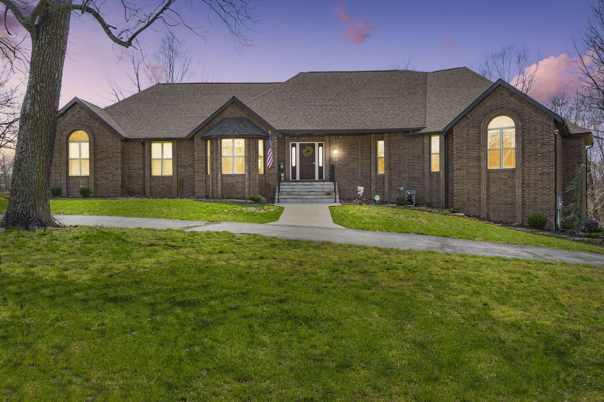 Welcome home to 8270 West Farm Road 160, in Republic! This is the property you have been waiting for, and it is finally on the market! The design of this property is perfection. From the paved circle drive, mature trees, and picturesque setting you will feel at home the moment you arrive. This 5,500 sq ft home sits on 10 pristine acres and was completely remodeled in 2020.  The home features 4 spacious sized bedrooms, 4 bathrooms, and a 3 car garage. As you enter the front door through the foyer you will be greeted by a kitchen perfect for entertaining that features; a large island, granite countertops, stainless steel appliances, including a formal dining room and breakfast nook. Off of the kitchen you can enjoy your morning coffee on the large screened in patio overlooking the land. The upstairs living room features a sitting area and warm pellet stove perfect for those cool evenings. The master bedroom suite showcases a private deck, large master bathroom with granite countertops, walk in shower, and a large walk in closet.The walkout basement features an in-laws quarters that has a second living area, bedrooms 3 and 4, a second kitchen/wet bar, workout area, fireplace, and a huge bonus room that could be an office, craftroom, playroom or nonconforming 5th bedroom. All the bedrooms, bathrooms, laundry room, and closets are oversized, SO MUCH STORAGE SPACE! Property also includes a 40x60 outbuilding that is both a shop and barn. Shop portion is complete with concrete floors and electric. There is also a brick gardening shed, automatic waterer for animals, and a year around creek. This beautiful property truly has it all. You will have plenty of space to make it your own, and to feel the peace of the country while still being just 10 minutes from town. Schedule your showing today!