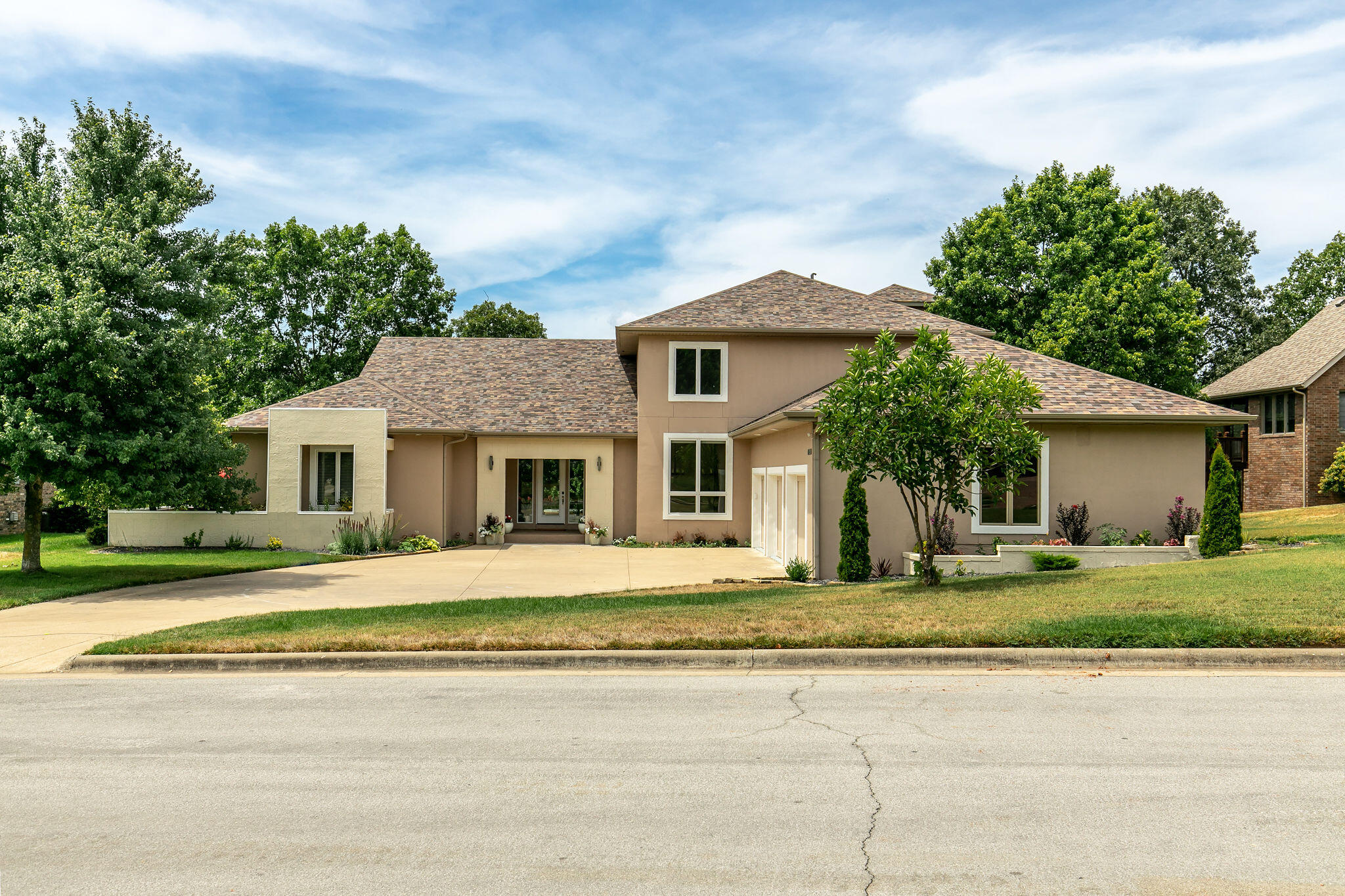 Located in the desirable Rivercut Golf Course community, is this stunning custom built luxury home. With 4 bedrooms, 4.5 baths and over 6,300 square feet of living space, this home has plenty of space for any family. Entertaining is a dream whether you are indoors or outdoors with a great open floor plan, 4 different living spaces, a custom kitchen featuring Brazilian Cherry wood cabinetry, center island and breakfast bar with seating. Tall ceilings flow throughout the entirety of the home creating an open and bright space. The master suite has a coffee bar, walk-in shower, massive walk-in closet, washer/dryer hookups and ample amounts of cabinet and countertop space. Above the main living space is a great loft style office space. The finished basement offers additional space and is complete with a second kitchen, a great game room, additional bedroom and bathroom as well as a full movie theater. Enjoy the outdoors while relaxing the completely covered outdoor living space with built-in grill space and a beautiful fire-pit. The views of the backyard are private and stunning. The custom features of this home are endless! Schedule your showing today.