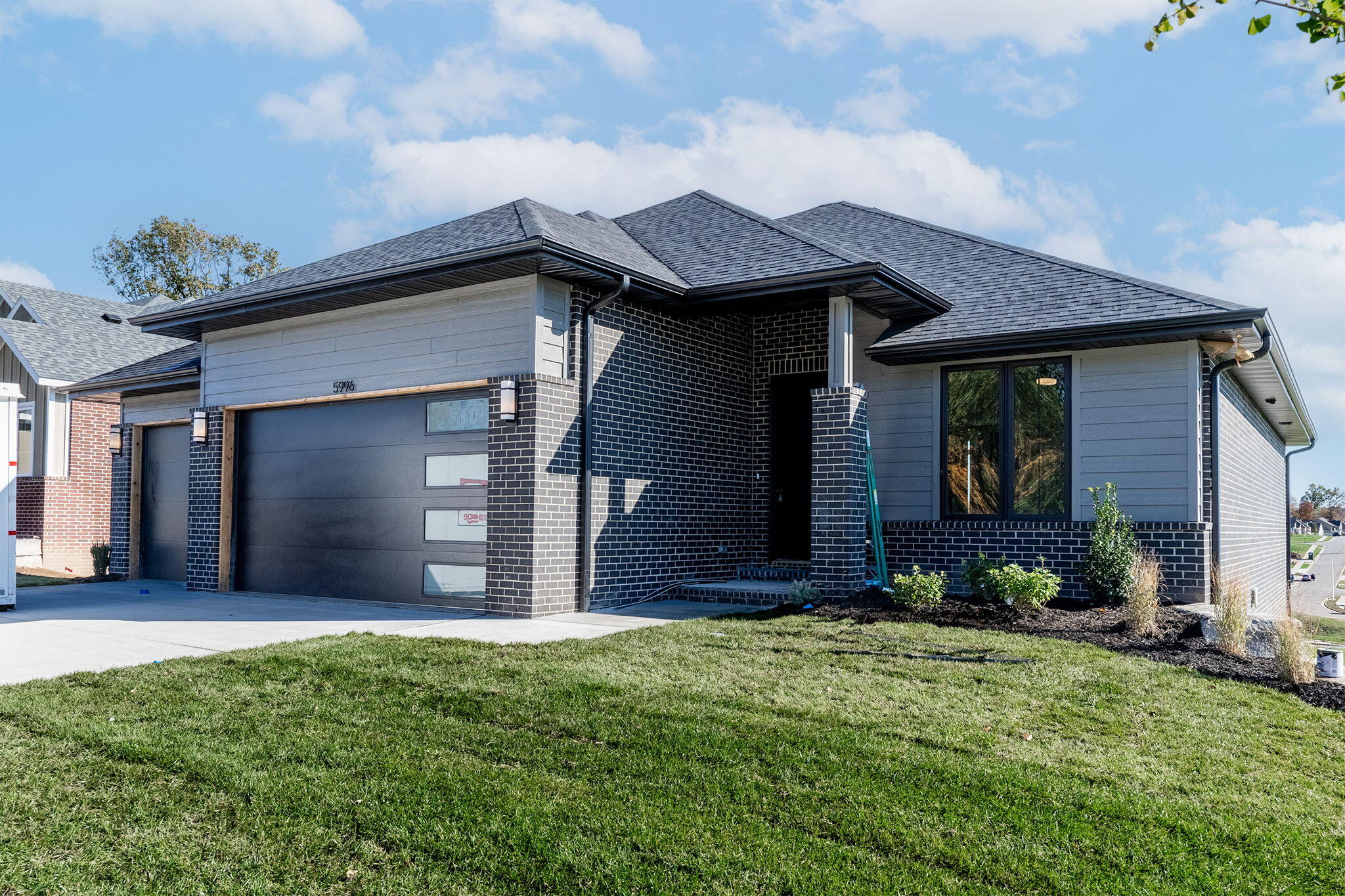 Beautiful new construction walk-out basement home in a premiere neighborhood on Springfield's South side. This corner lot property features an open concept living room with 11 ft ceilings, large windows, and gas log fireplace. Kitchen has large center island, quartz counter tops,  walk-in pantry and dining area. Master en-suite has dual sink vanity, 5' walk-in shower, and walk-in closet with access to laundry room/mudroom. Back deck is accessible from primary bedroom and dining area.  Main level is completed by a guest bedroom and full bathroom.  Basement offers a large family room w/wet bar, 2 bedrooms, a full bathroom, and a John Deere room.  3 car garage.  Kickapoo Schools.  Excellent location minutes from the medical mile.