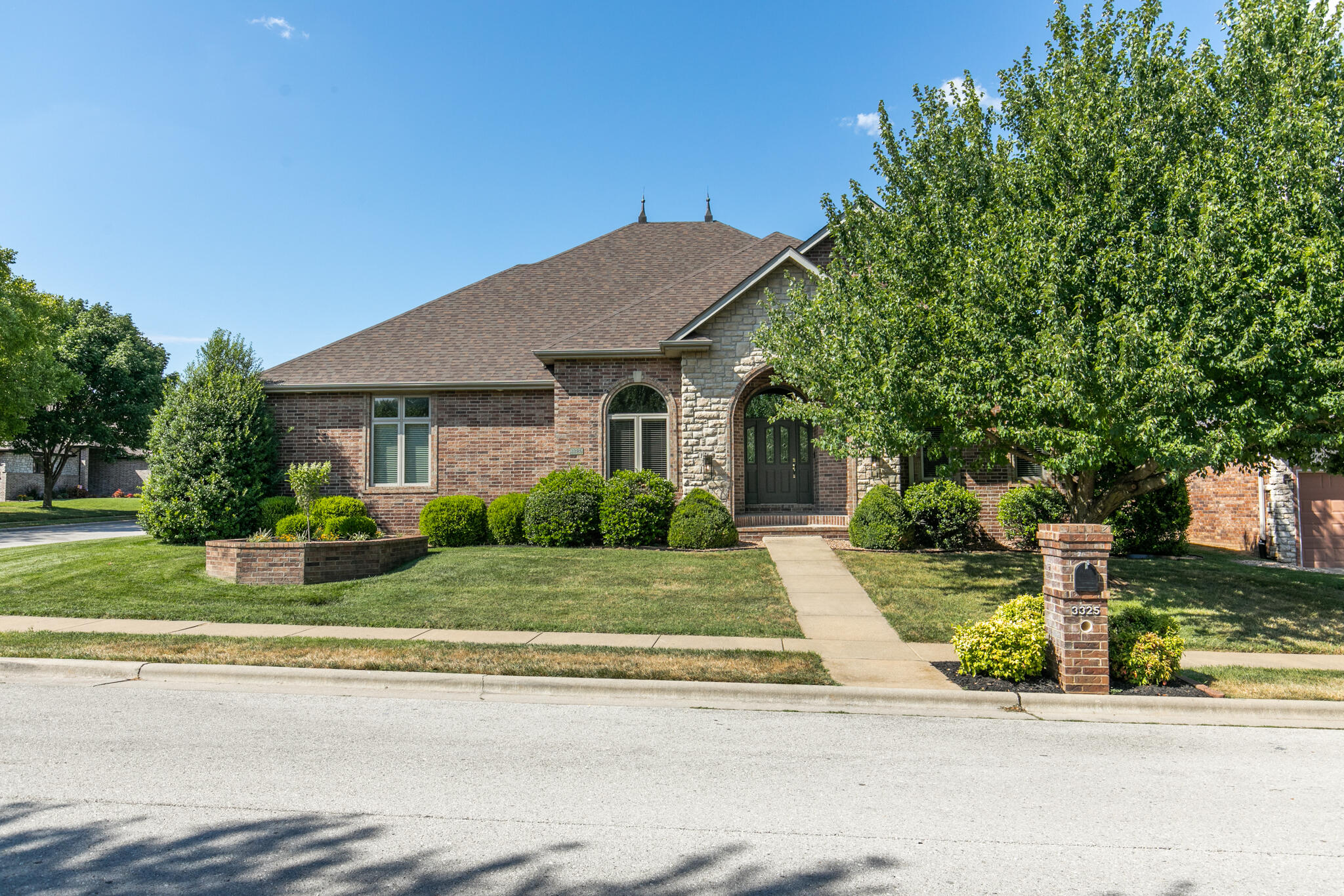 Stunning single level Fox Grape home!  Situated on a corner lot, home features an all brick and stone exterior with 4 bedrooms, 2 full and 2 half baths, a 3 car garage, and a finished attic space!  Brand NEW roof! Enter from the covered front porch to tall ceilings, new light fixtures, ample natural light, and beautiful new flooring throughout. At the front of the house is a formal dining and living room that leads into the gorgeous kitchen. Kitchen features black and white refinished cabinets, granite counters, hardwood floors, newer all black appliances, a built-in desk, kitchen bar, and an island!  Off the kitchen is a 2nd dining space with bay windows, 2nd living room with a gas fireplace, and a heated/cooled sun room!  Oversized primary bedroom suite has been completely renovated and features two walk-in closets, his and hers sinks, and a tile walk-in shower.  3 more bedrooms, one with French glass doors that would make a great office, share a full bathroom with dual sink vanity.  There is also a powder room, large laundry room, and an extra half bathroom in the garage.  Abundant storage throughout the entire home with extra storage space in the garage and a work bench.  The fresh landscaping and gazebo makes the privacy fenced backyard feel like an oasis.  Located only one block from Sequiota School and trails.  Call to schedule your tour today!