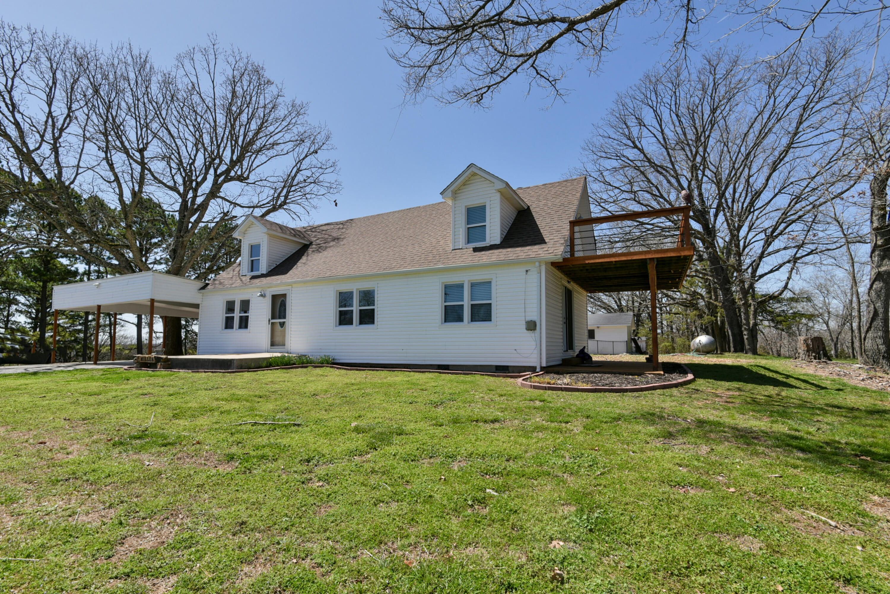 Here is your opportunity, Making the old look new is easily done here!  This home has every update possible all the way from flooring to plumbing.  Each room spacious and bright with modern colors.  All new cabinets in this fully updated kitchen with granite countertops, too.  Master suite has been added to this farm home to make it  move in ready for you and your guests. Upstairs living area is spacious and has a balcony for peaceful evenings at Table Rock Lake. Owner has confirmed through the HOA that this home is nightly rentable allowed!  Owner would consider an owner finance with the right terms.  Boat slip available, info coming