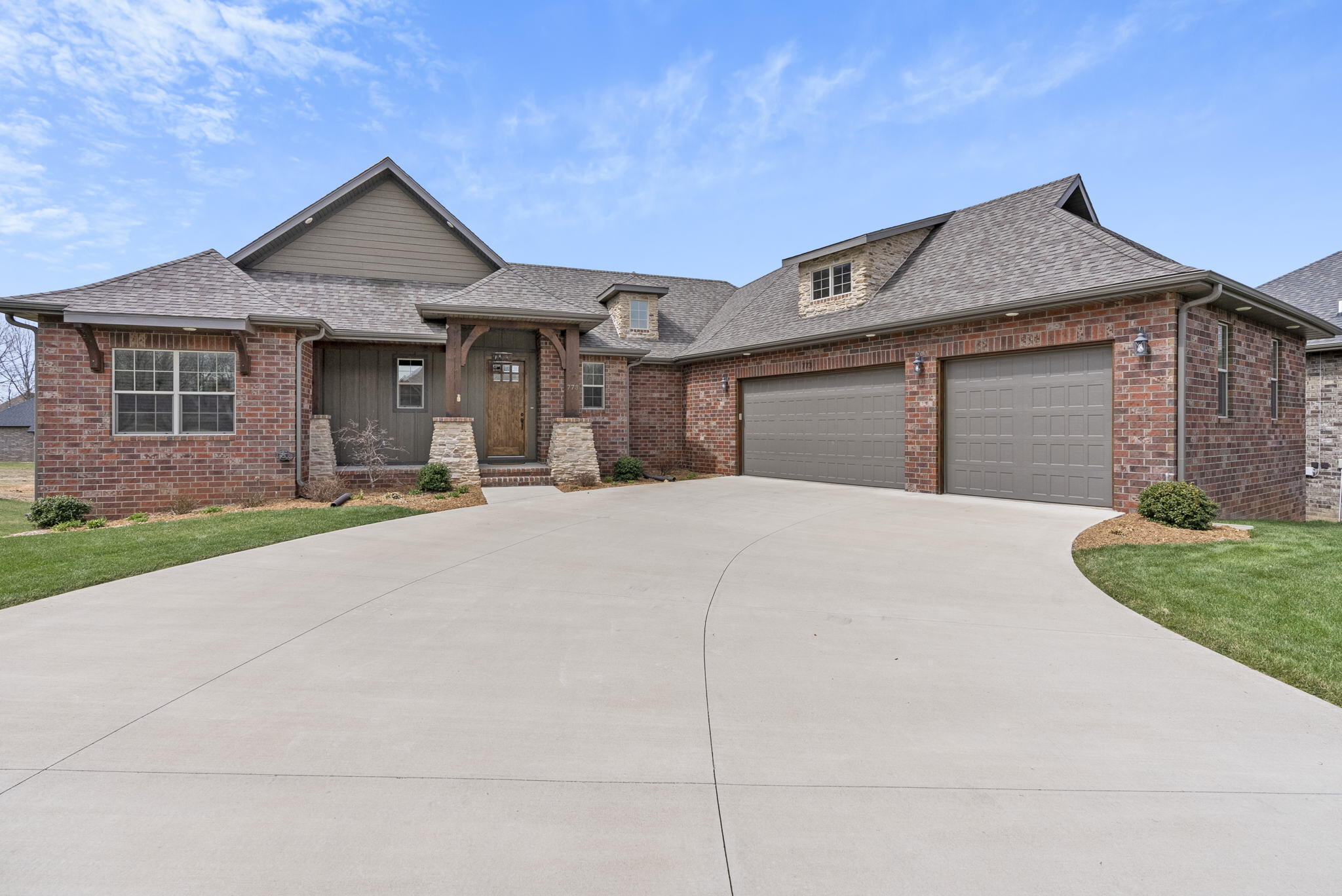 Just East of Springfield in Forest Trails, a gated community, this 5 bedroom 3 bathroom walkout basement home was built in 2019 by Oller Building Company. With granite counters and soft close cabinetry throughout you will quickly discover this 3 year old home is in pristine condition and truly move-in ready. The open concept living room and kitchen feature a beautiful stacked stone gas fireplace, large island, stainless steel appliances, gas range, double ovens and a hidden pantry. The mudroom with built-in storage and laundry room are right off the kitchen along with a closet that stores the homes surround sound system components. Meals can be enjoyed in the dining area alongside the kitchen with plenty of room for a large table or al fresco in the screened porch as you watch the sunset. As the front of the home faces East and the back West all windows have been professionally tinted for energy efficiency and comfort. The main floor offers a split bedroom floor plan with the master suite on North end and two additional bedrooms and full guest bathroom on the South end. Downstairs the large family room provides a spacious area for entertainment complete with a wet bar and additional space for exercise equipment or other crafting and hobby spaces. Along with 2 unfinished storage spaces and a storm room the walkout basement level provides two more bedrooms and a 3rd full bathroom. Situated on a cul-de-sac this well maintained home features beautiful landscaping with a full irrigation system in the front and back yards. Just outside city limits this home is convenient to shopping, highway 65 access, Hickory Hills Elementary/Middle School and Glendale High School.