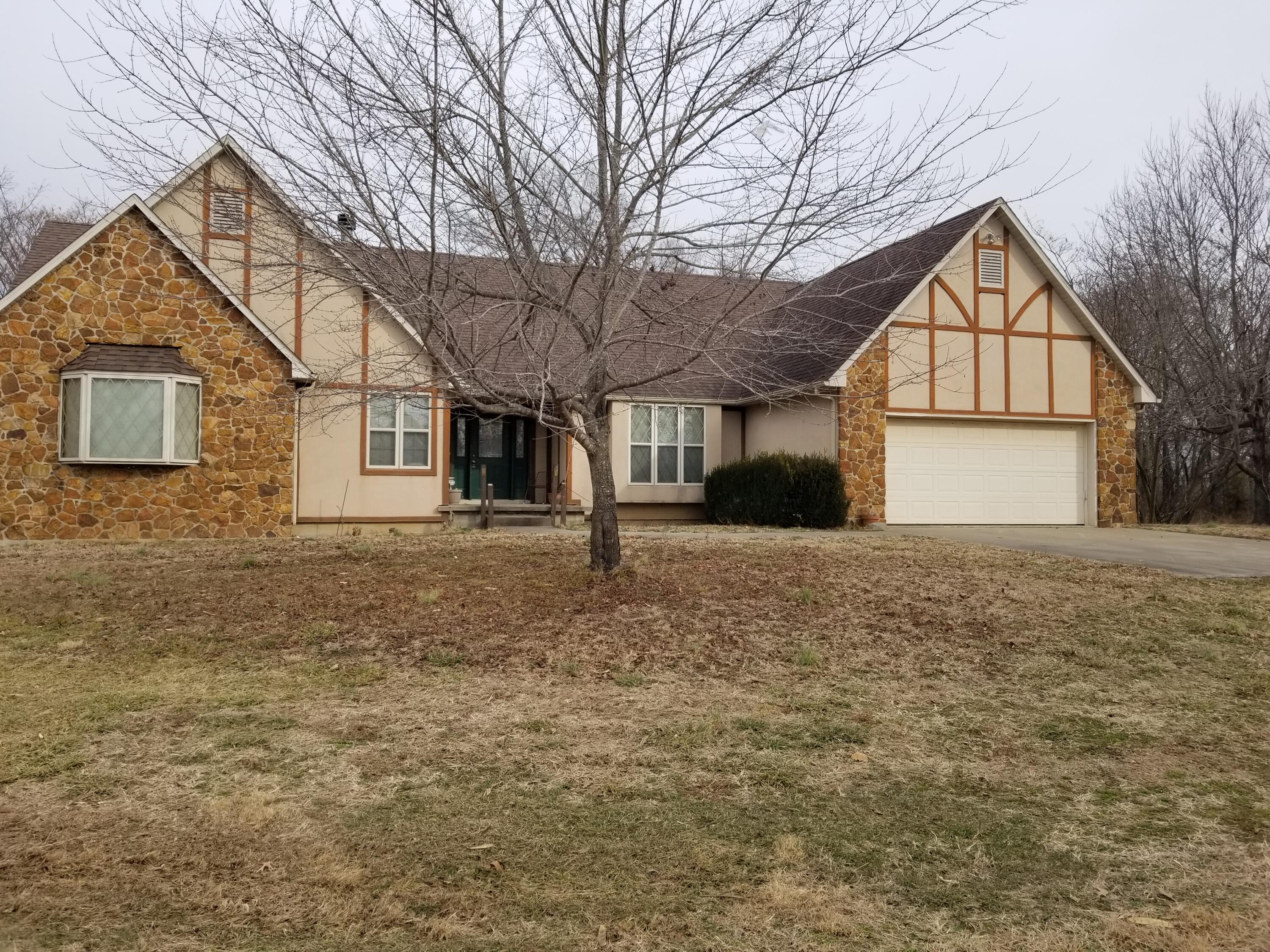 Three possibly four bedroom with 3.5 baths custom built home on 80 acres of awesome hunting ground close to sac river. Comes with a 35 by 40 shop. This property is located close to Stockton Lake as well as minutes from Truman Lake, Home was built in 1999 and nothing was spared. Home sits off of a paved highway for easy access but still private setting. If your looking for a nice home on  great hunting land close to area lakes this is your home. Don't let this one slip by. More pics coming soon.