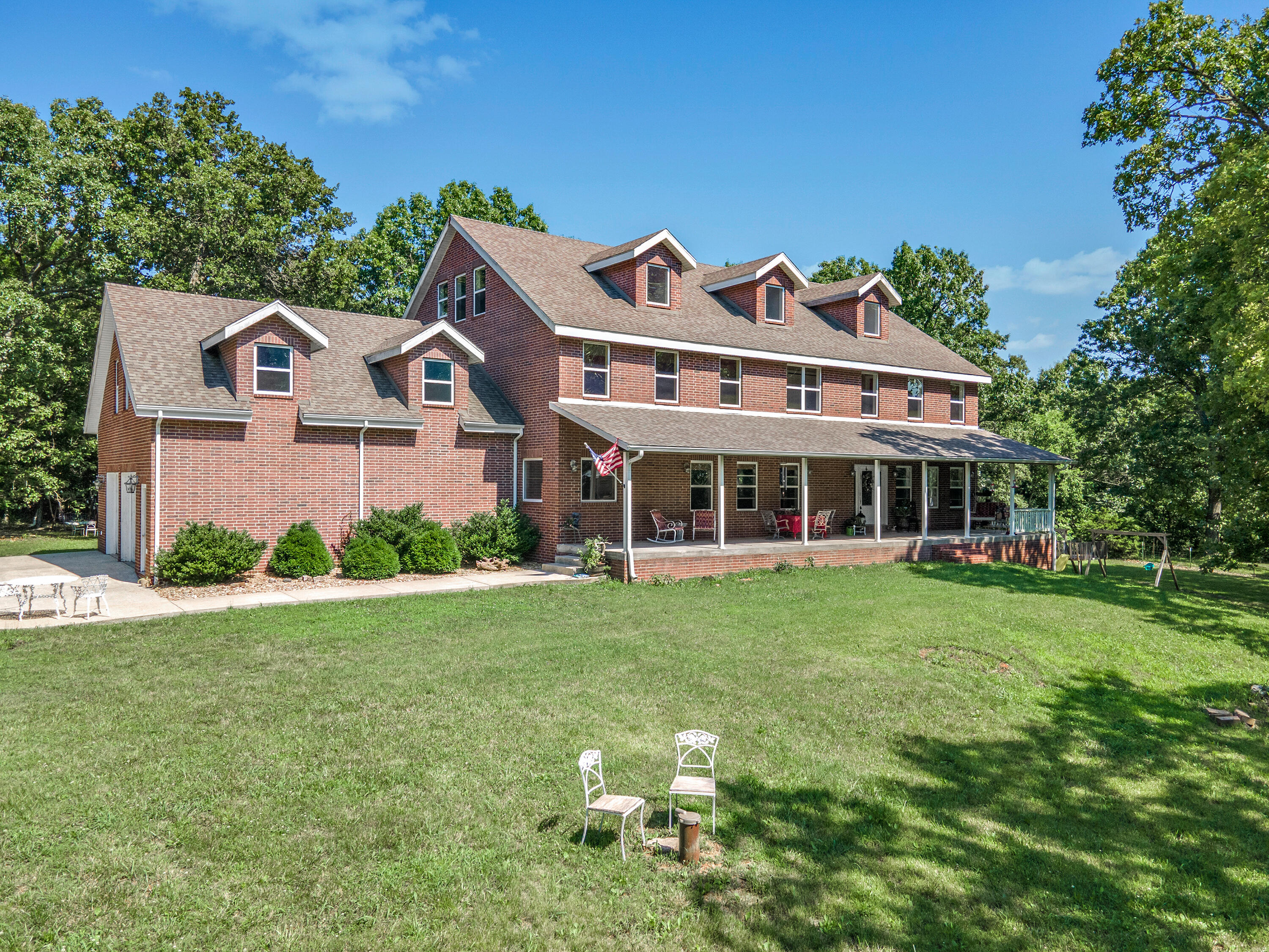 If you are ready to own your own piece of Paradise, then look no further! How about 8800 sq ft of quality nestled on almost 10 acres!?! This 4 story ALL brick home with concrete porches and 2X6 walls, wired for a generator and all for under a Hundred dollars a square ft is a rare find. It boasts 9 ft tall ceilings at least and most rooms have cathedral ceilings. Private setting with outstanding quality within 45 minutes of Branson and the Lake areas as well as Springfield and Joplin. Endless opportunities await with this home, whether it be entertaining or just enjoying the pristine setting with family . Don't let this rare find get away!!
