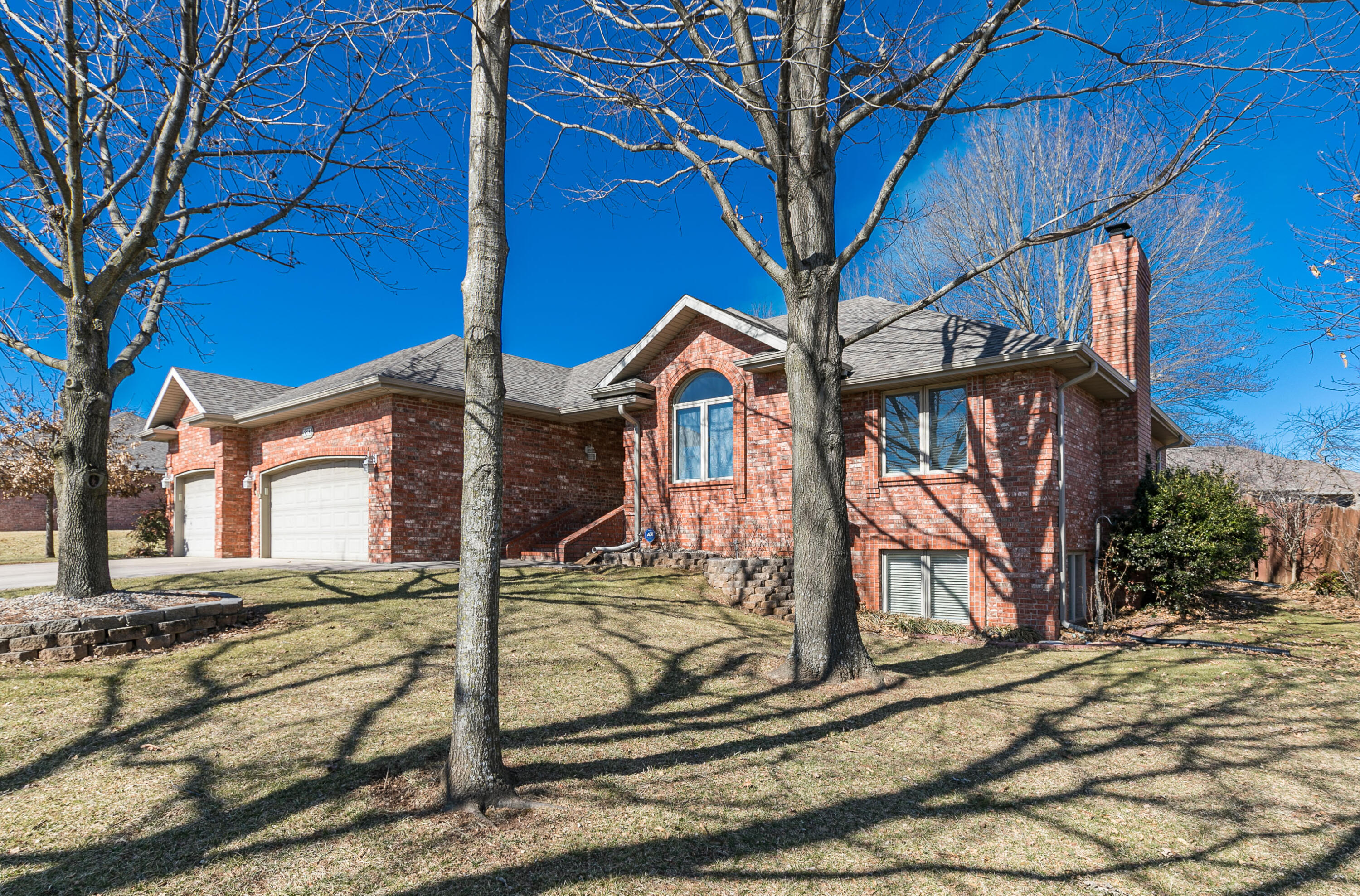 Fantastic Find! All-brick, One-owner Custom-built home with TOP-NOTCH Quality and Construction Throughout! Boasting over 3400SF (4th bedroom is non-conforming). A grand foyer welcomes you to soaring ceilings and a bright and cheery main level. This Stand -Out floorplan is anchored by a central living room with floor to ceiling woodburning fireplace. The master suite is a special treat with both a large traditional room and an attached bonus room that would make for a wonderful home office, nursery, exercise room or so much more! The areas are joined by French doors, and both enjoy a double- sided gas fireplace! There is a huge closet and the private ensuite will not leave you wanting, with large walk-in shower, soaker tub and double sinks. The enormous kitchen is a cooks dream with gas stove, tons of thoughtfully designed custom hardwood cabinetry, ample countertop space and a Huge attached eat-in area with direct access to the large, covered back porch. Custom built-in cabinets at every corner, lighted plant shelves and 6- panel doors adorn the home.  There is a guest room with vaulted ceilings and a full private bath. All of the closets have wooden shelving. The full-finished basement enjoys a wide-open living space with full size windows and 9' ceilings. A free-standing Buck stove provides inexpensive heat for the whole house. There is also a full bathroom, large bedroom with walk-in closet and another room that would make for a great media room, office or non-conforming bedroom.  There's a hobby/craft/storage room that provides a great out-of-the-way place for projects and an under porch ''Storm room.'' The 3- car garage is oversized and has walk-through access to the back yard. The back yard enjoys a private feel with full-privacy fencing, lots of mature shade trees and plenty of space for entertaining and activities. Extremely well-cared for home with new roof in 2020 and added insulation make for carefree, inexpensive living. Average utility bill is $150 for