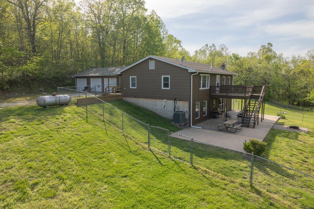 Home, home on the Range...you can't help but sing a song that evokes the comfort of country living when you visit this idyllic rustic retreat on over 5 acres. This property provides a mix of cleared and wooded areas - there is a fantastic yard space, perfect for all of your playing/planting dreams along with some amazing wooded space to explore. This home is clean and comfortable. The setting is peaceful and the views serene...where the skies are not cloudy all day. It provides 4 bedrooms, 2 bathrooms, open living areas, a walkout basement and a 3-car attached garage. You have the choice of Neosho or Seneca schools. Enjoy the convenience and beauty this area has to offer; envision how you can make this home yours. Come check it out and you'll see why the last owner cherished it for 15 years. It's the ideal setting for creating lasting memories with your loved ones and a place where you can start living the country lifestyle you've always dreamed of. Come Home. Welcome Home.