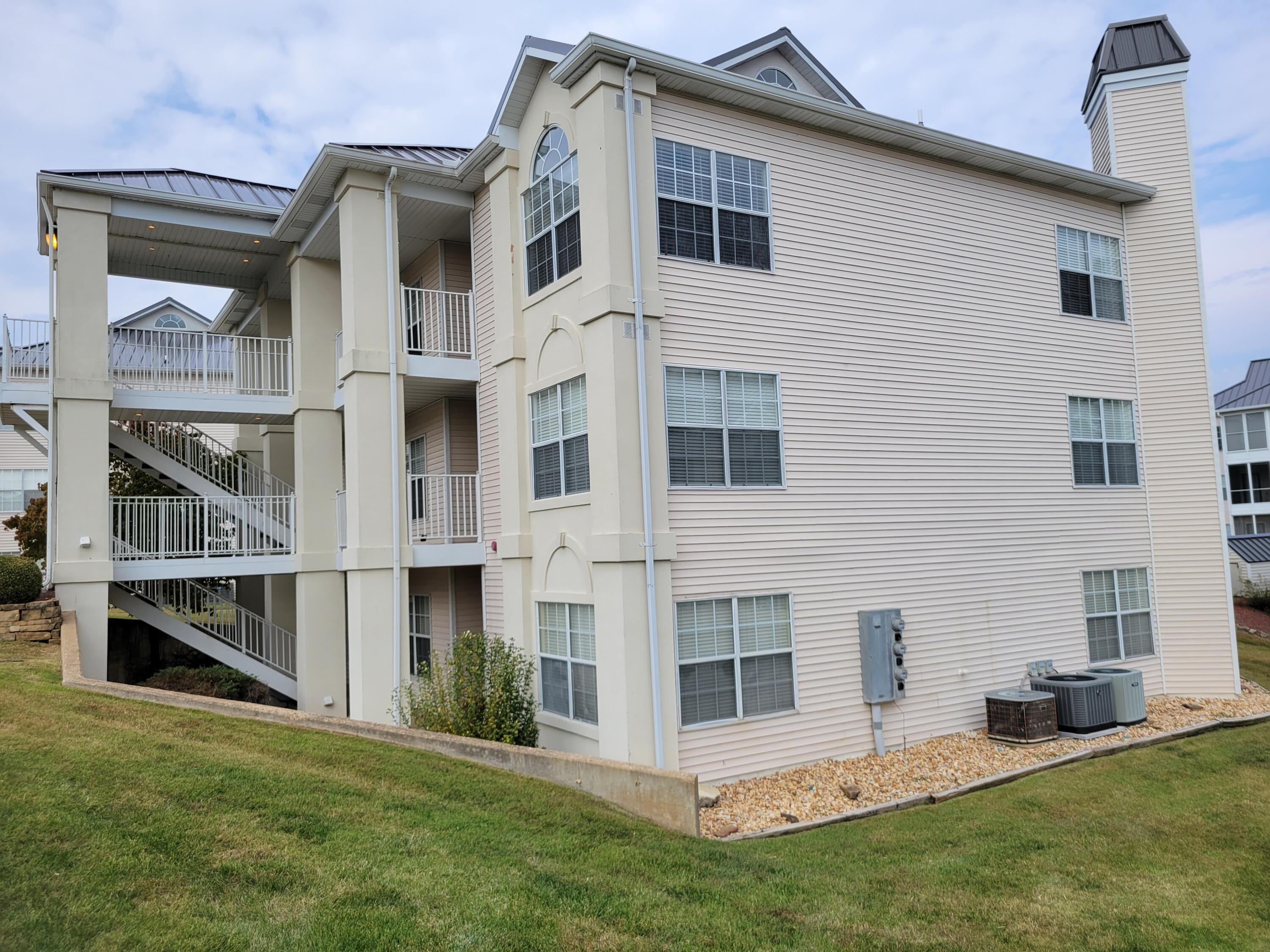 Nice, clean and comfortable condo. Desirable location with condominium amenities (pool, grills, etc). New metal roof on building.Walk in off the parking lot option or use the stairs. Great enclosed sunroom for year round  enjoyment. Scenic landscaped pathway with tressel. Owner may consider selling some furnishings too. So many amenities for fun close by.