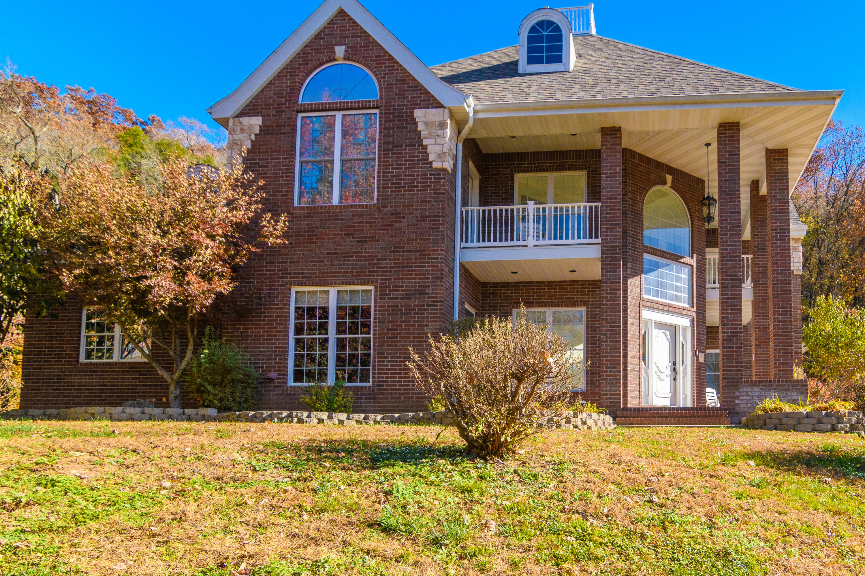This one-of-a-kind property tucked away on a hillside, overlooking the quiet neighborhood of Riverside Estates. AMAZING VIEW, of Lake Taneycomo. 5 bedrooms, 4 full baths, and one 1/2 bath. Main level features Living room, fireplace, Kitchen, Dining, Office, main bedroom, full bathroom, additional bedroom, and bath, beautiful entry/foyer, open to second story.  Second story, additional bedrooms, bathrooms, hobby/movie room, and hearth room. Laundry/mud room off kitchen. Large backyard. 1.17 acres for entertaining with beautiful waterfall and pond. New roof and gutter system. Neighborhood has boat launch for Lake Taneycomo.  Three car garage.  Close to Branson, Hwy 76 Entertainment, and 12 minutes from the famous Branson Landing. A MUST SEE! Beautiful luxury home , ready to be yours. NO HOA