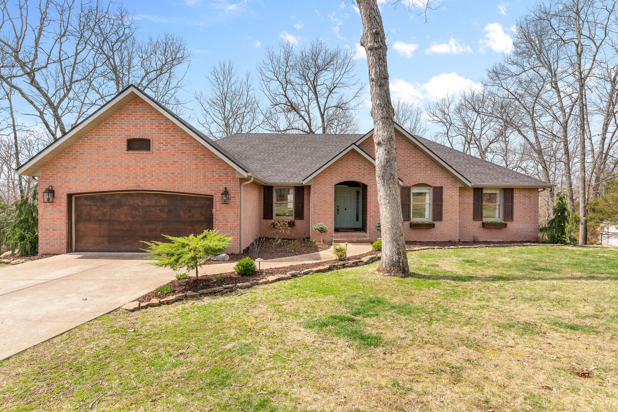 Phenomenal walkout basement home on 3 acres in James River Estates with 3 sides brick & back is cedar. Blends nicely with the setting that has irrigation system and invisible pet fence.  This home boasts 4 large bedrooms,  lots of storage areas, formal dining room,  hardwood, ceramic tile & engineered hardwoods throughout, Custom maple cabinetry with many built-ins, Corian countertops, remodeled bathrooms, wet bar, 2 woodburning fireplaces and large John Deere Room/workout room. Large deck & side screened in porch, plus oversized covered back deck.  The 3 acres are in a cul-de-sac with built-in fire pit areas, swing set and trampoline that convey with the home.